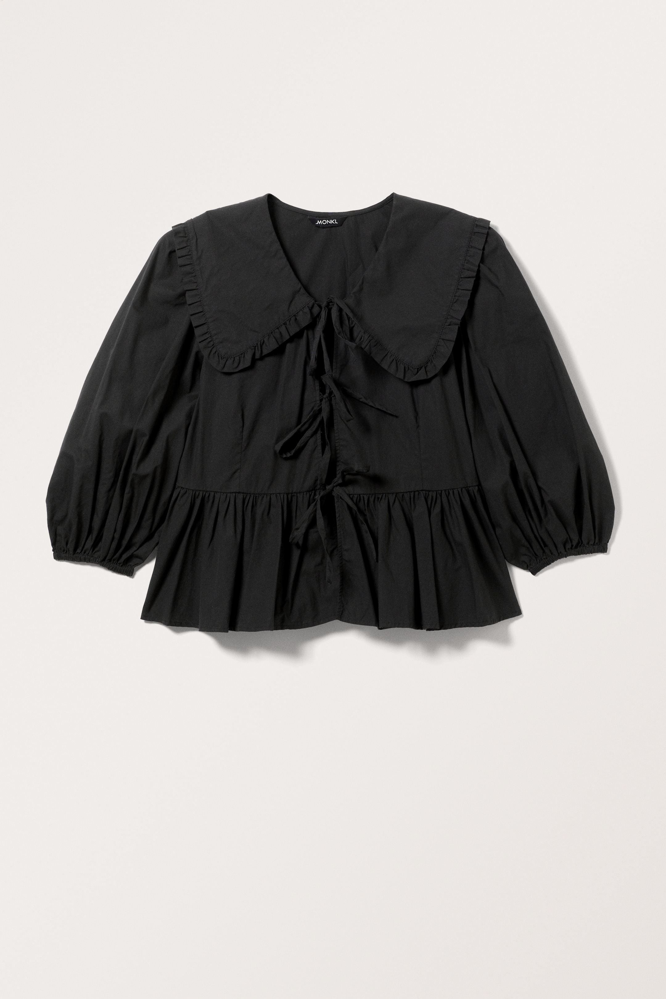 Visa större bild: Peplum poplin-blus - Svart - DAM | H&M SE 1