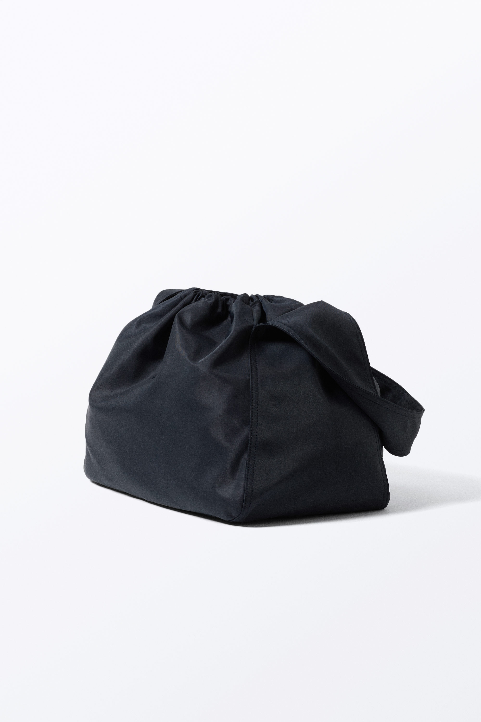 large rectangular drawstring shoulder bag - Dark Blue | Monki GB