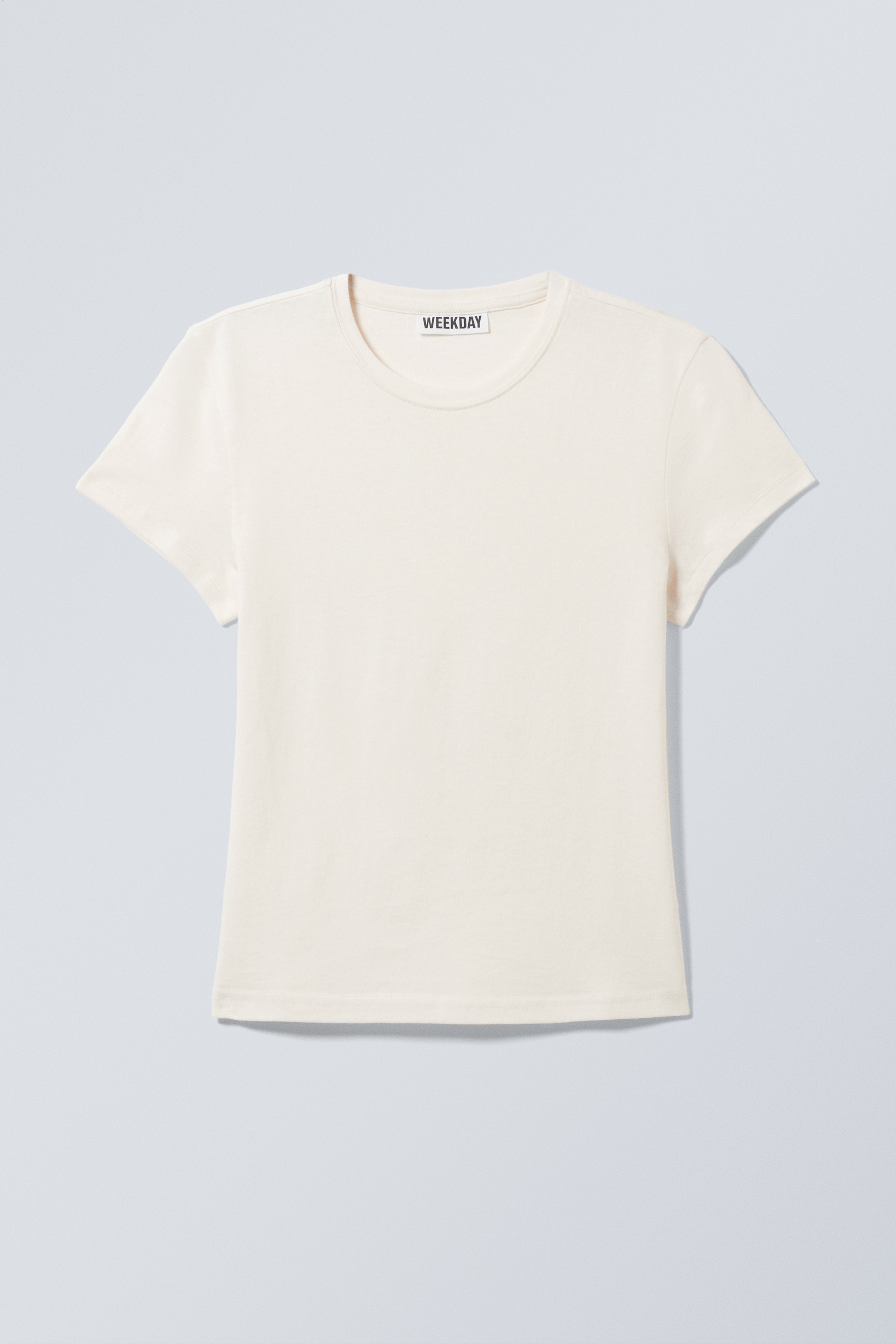 Visa större bild: Smal kortärmad t-shirt i bomull - Off-white - DAM | H&M SE 1