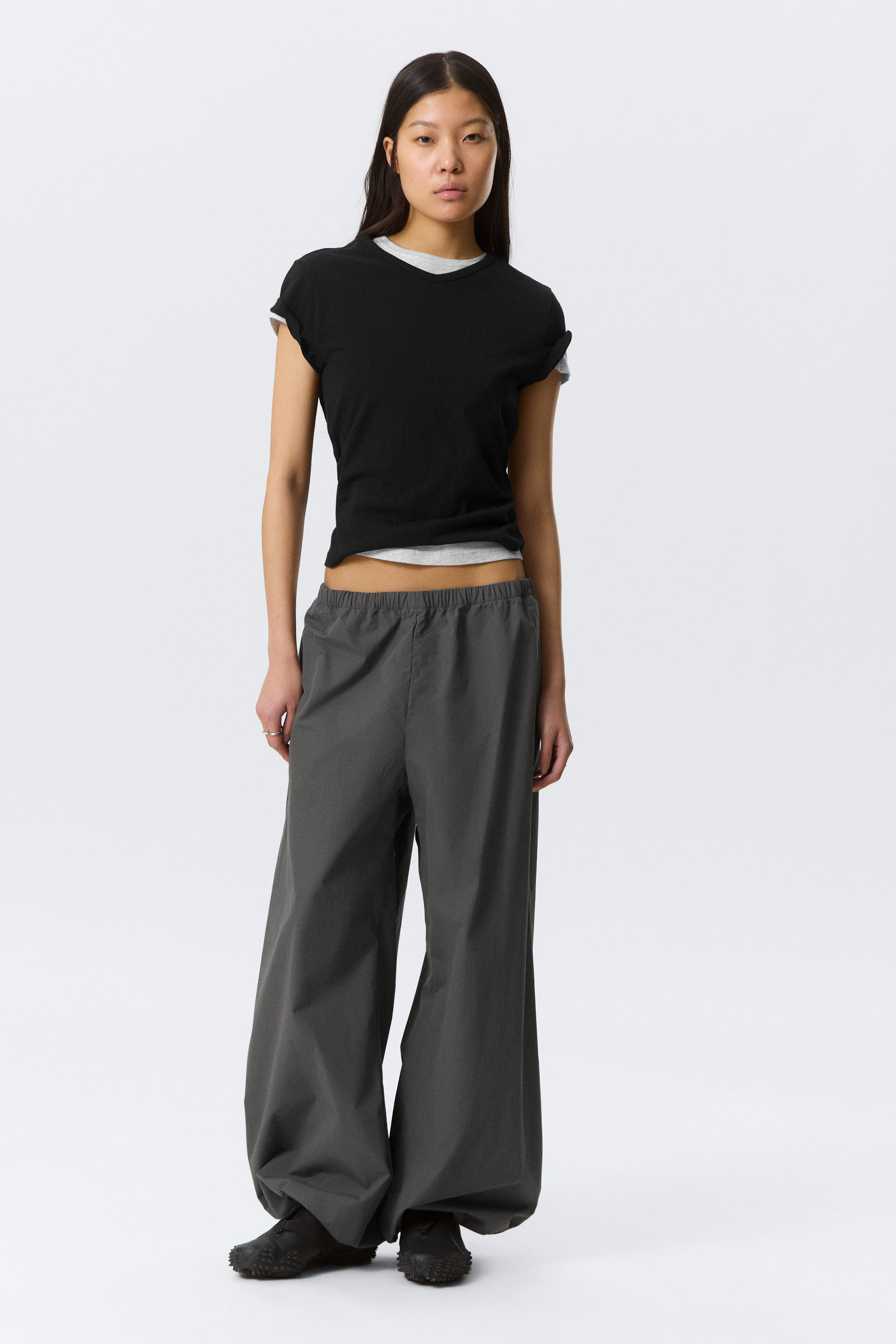 zip-off nylon track trousers - Black - Beige Stripe | Monki WW