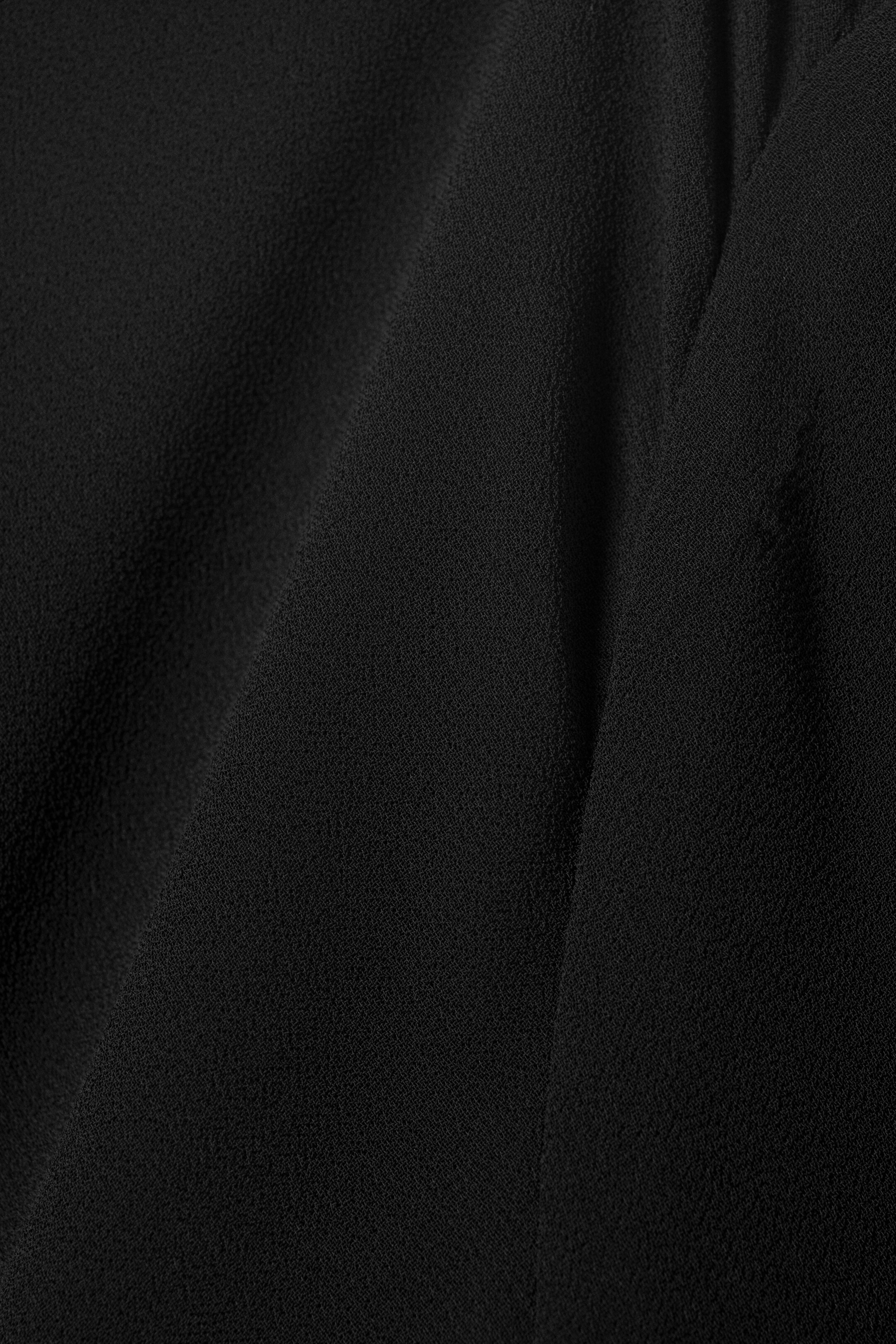 Grotere afbeelding bekijken: Doorschijnende asymmetrische blouse met lange mouwen - Zwart - DAMES | H&M NL 6