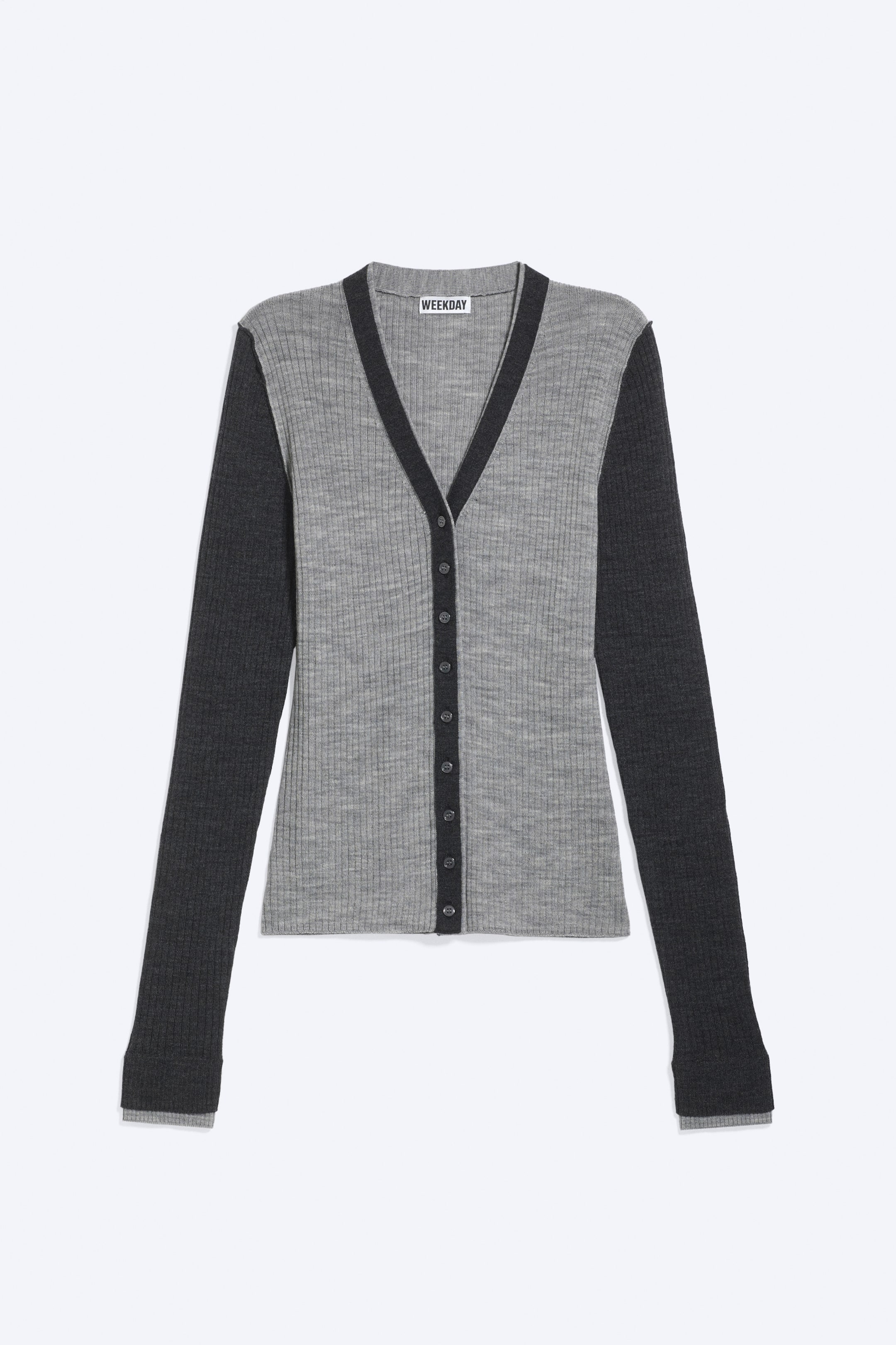View larger image: A two-tone cardigan featuring a light grey ribbed body and dark grey long sleeves. It is designed with a dark grey V-neck trim and a matching dark grey button placket, fastening with dark grey buttons.