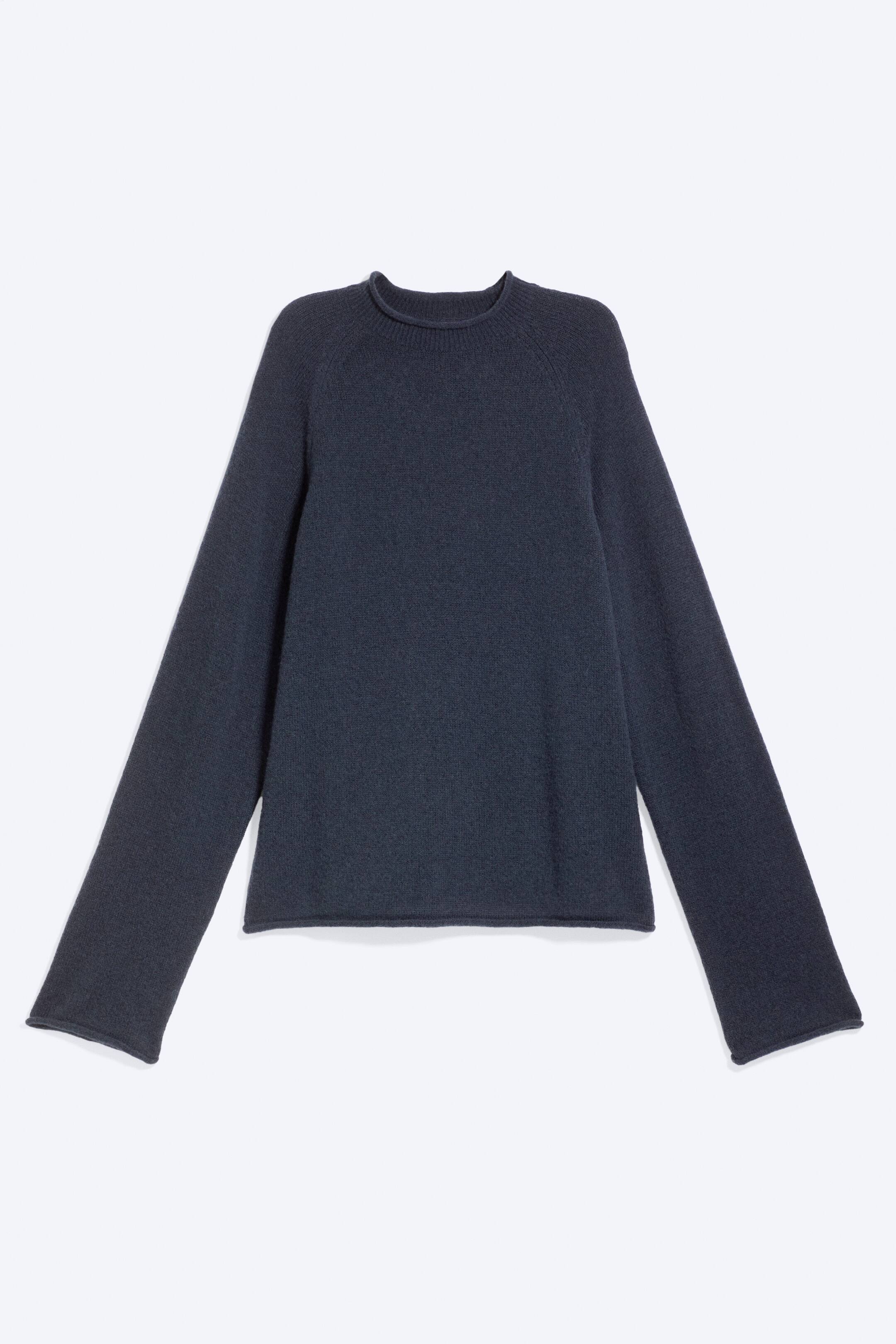View larger image: A charcoal grey, fine-knit jumper is facing front. It features a crew neck and long raglan sleeves, with the hem and cuffs presenting a clean, non-ribbed finish.
