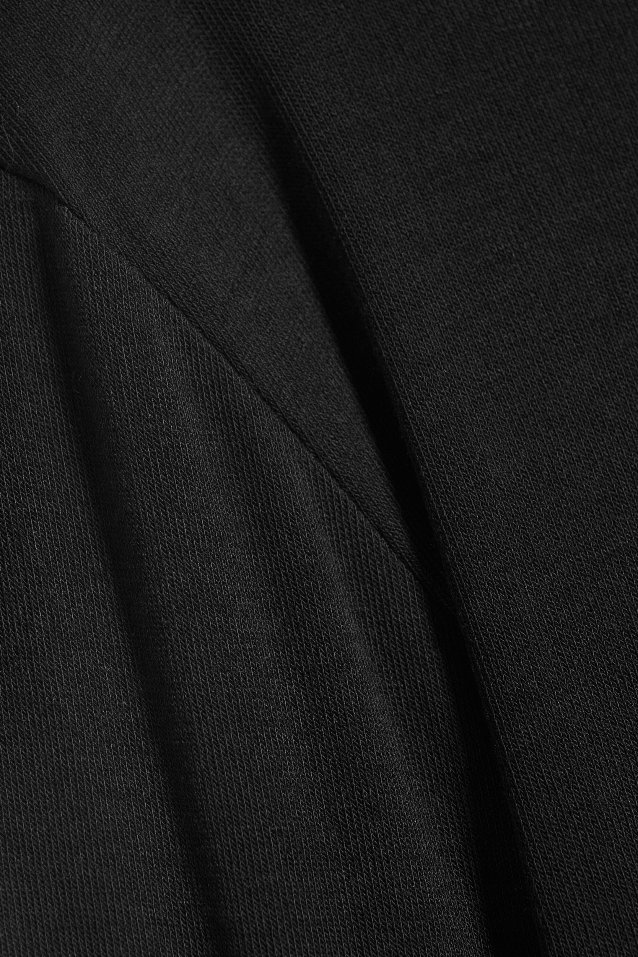 Schwarz - Schmal geschnittenes Langarmtop aus Wollmix - 1