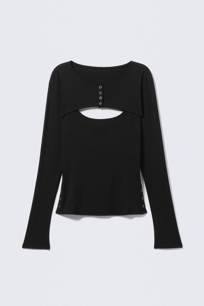 A black long-sleeved top featuring a round neckline and a cropped panel across the chest, forming a wide, curved cut-out below. Four silver-toned snap fasteners align vertically down the centre of the chest panel, with three matching snap fasteners visible on each side seam near the hem. - 1