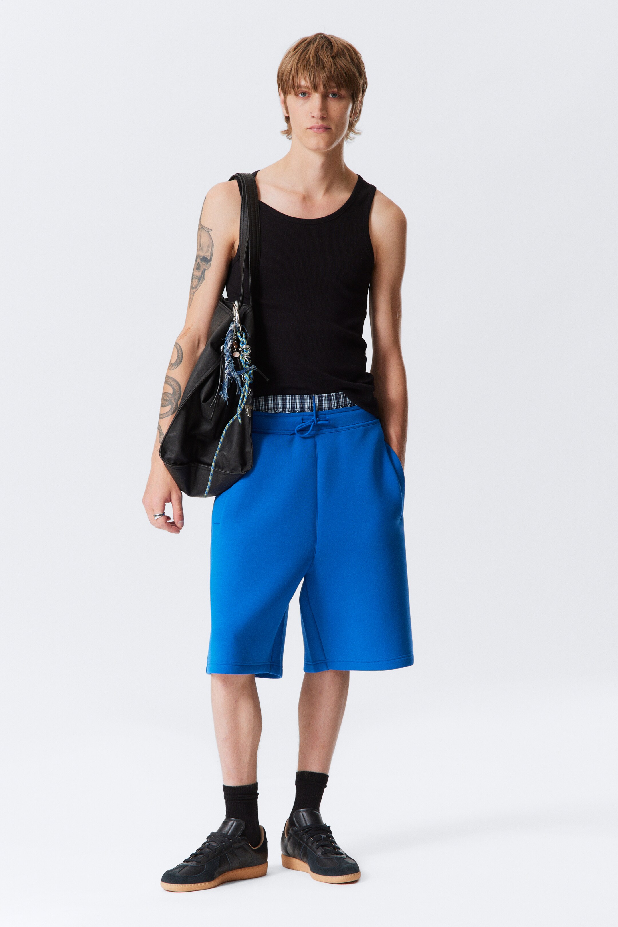 Visualizza immagine più grande: Shorts in scuba con vestibilità loose - Blu brillante - UOMO | H&M IT 1