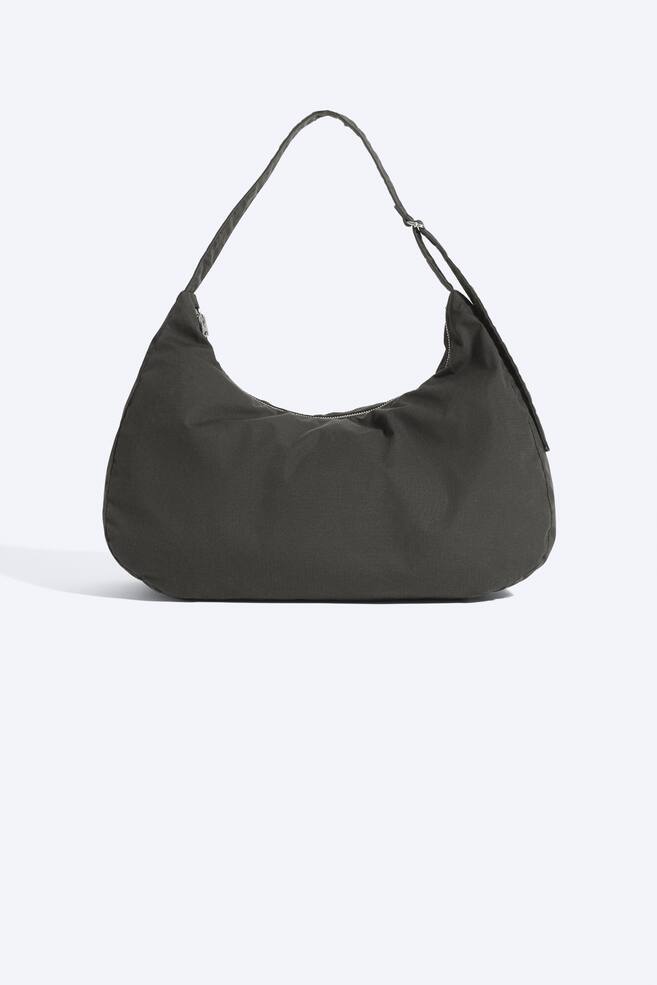 Half‑circle crossbody bag - Black/Khaki Green - 1