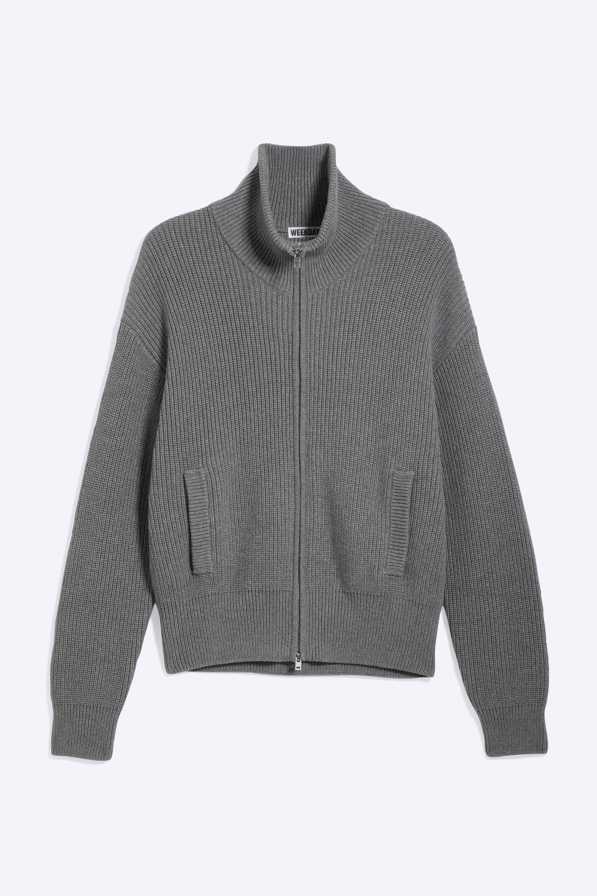 Ruimvallend gebreid vest met rits en hoge hals