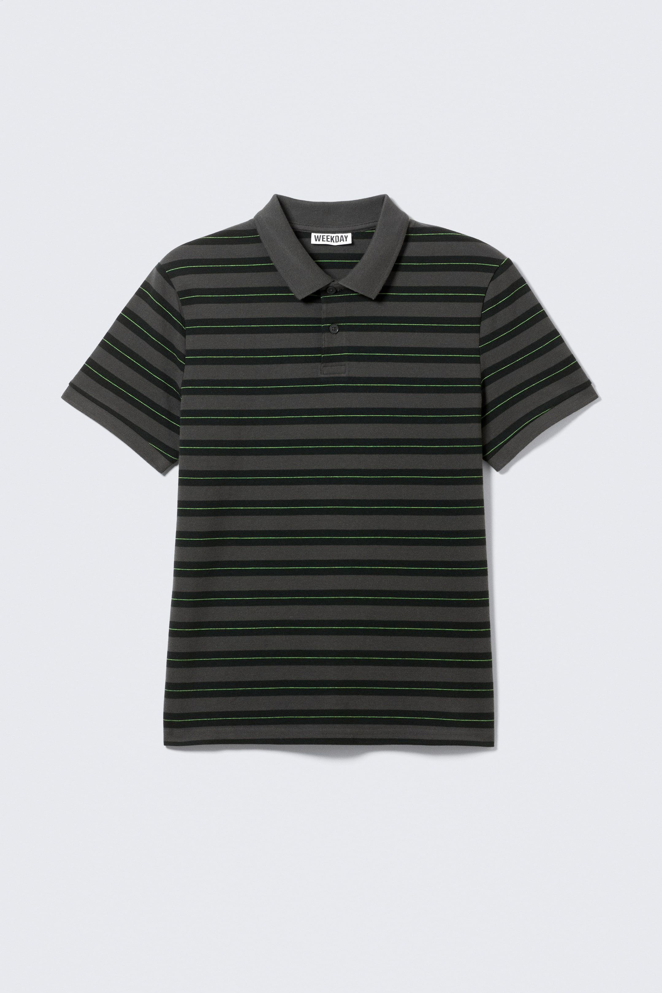 Ver imagen más grande: Una camiseta polo gris oscuro de FRONT presenta rayas horizontales. Rayas más gruesas de color carbón se alternan con rayas más finas de color verde neón a lo largo de la prenda, que está diseñada con mangas cortas, un cuello acanalado y una tapeta de dos botones.