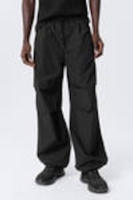 Black - Loose Pleated Parachute Trousers - 1