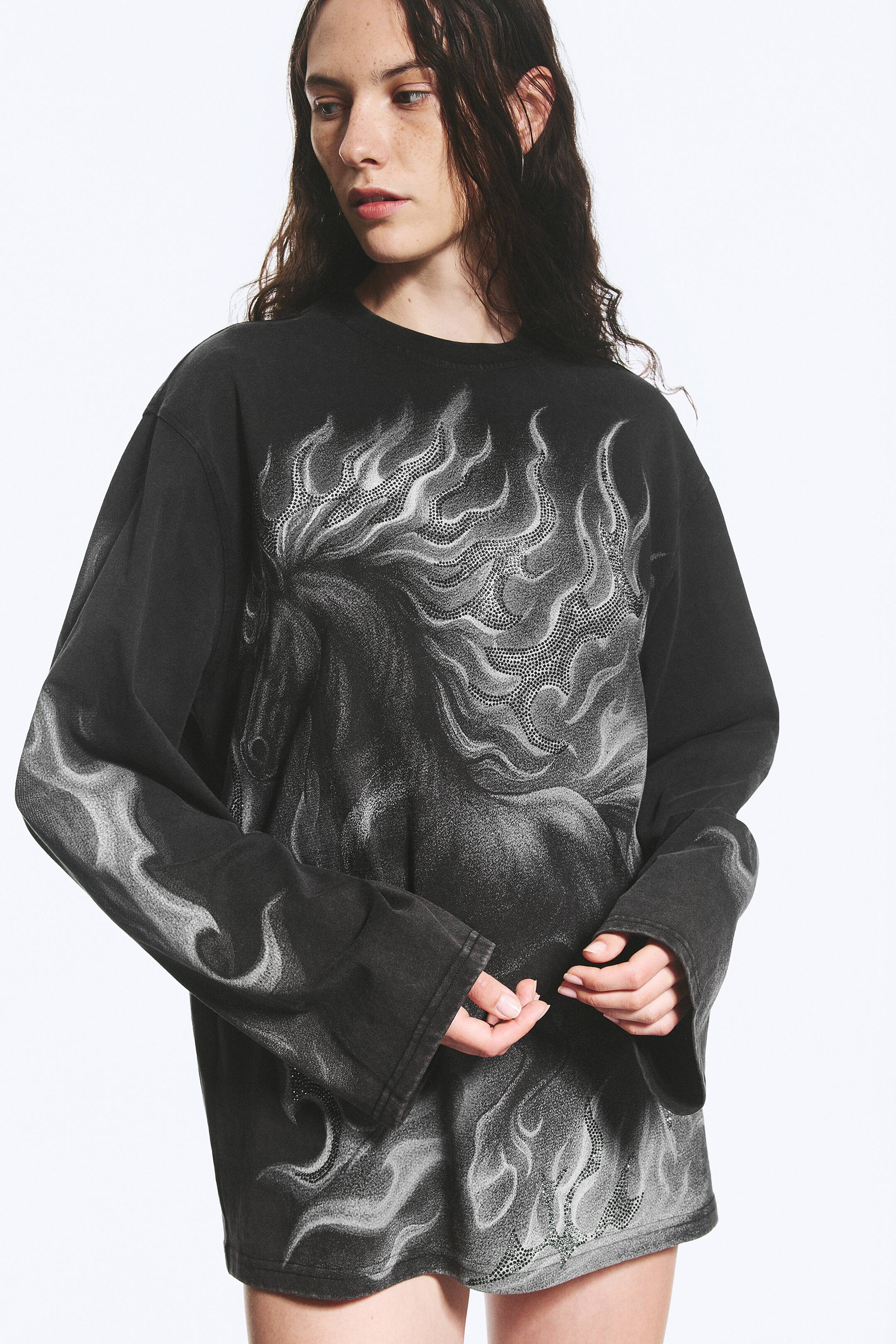 Se større billede: Oversized T-shirt med grafisk print og lange ærmer - Sort – hesteprint - DAME | H&M DK 1