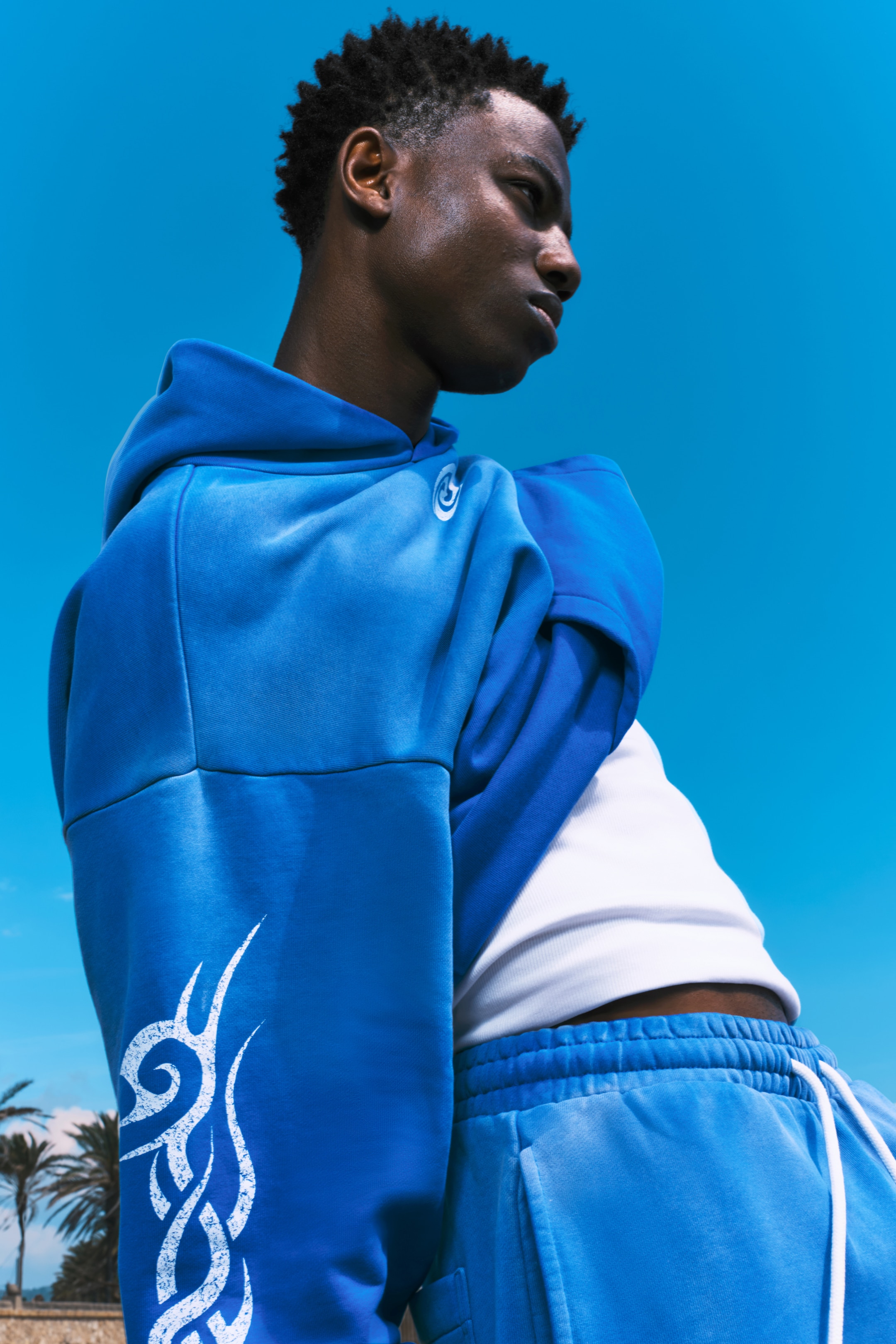 Grotere afbeelding bekijken: Square Loose Fit Graphic Hoodie - Sun-faded Blue - Swirl - HEREN | H&M BE 1