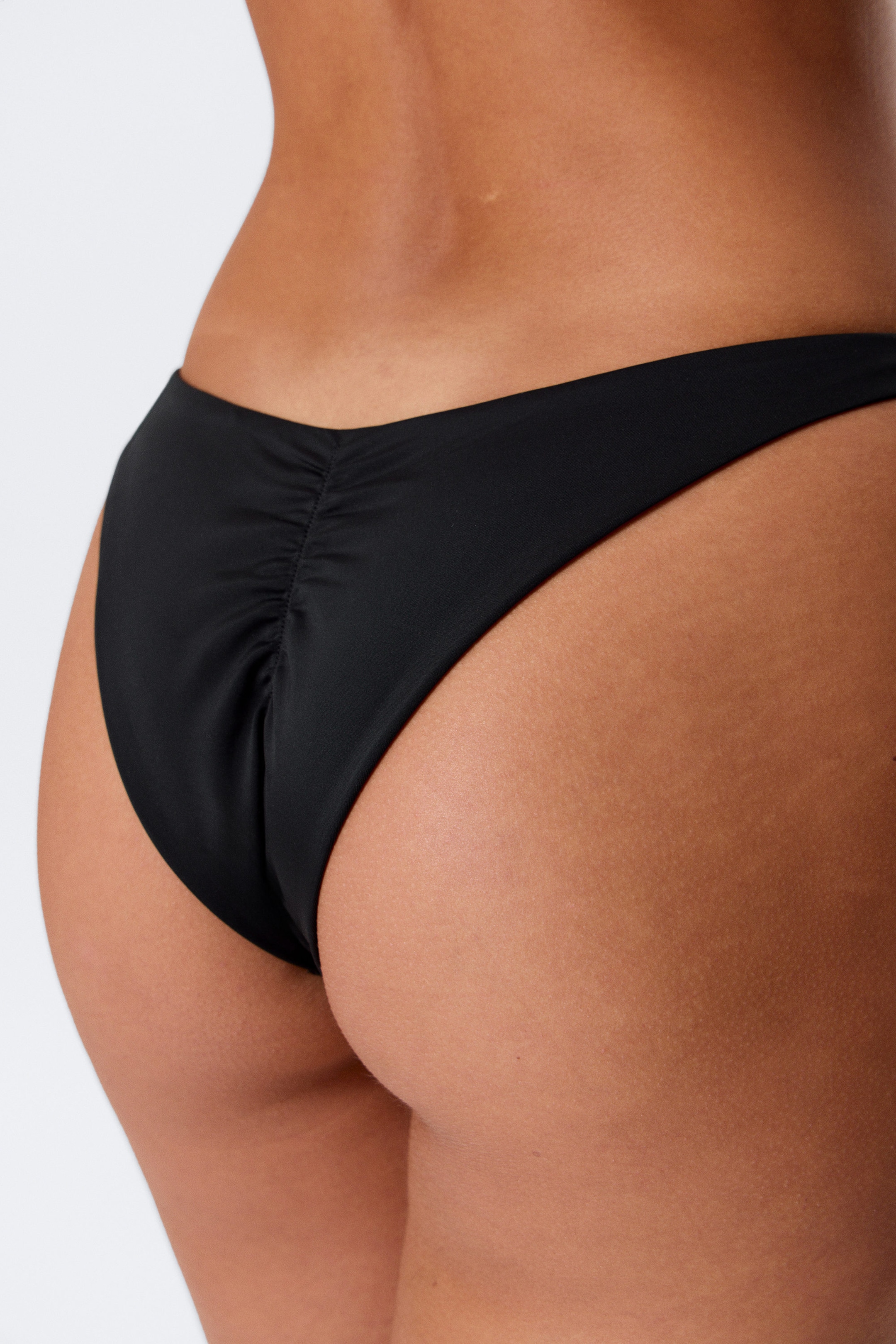 Black - Mid-Rise Ruched Brazilian Bikini Bottoms - 1
