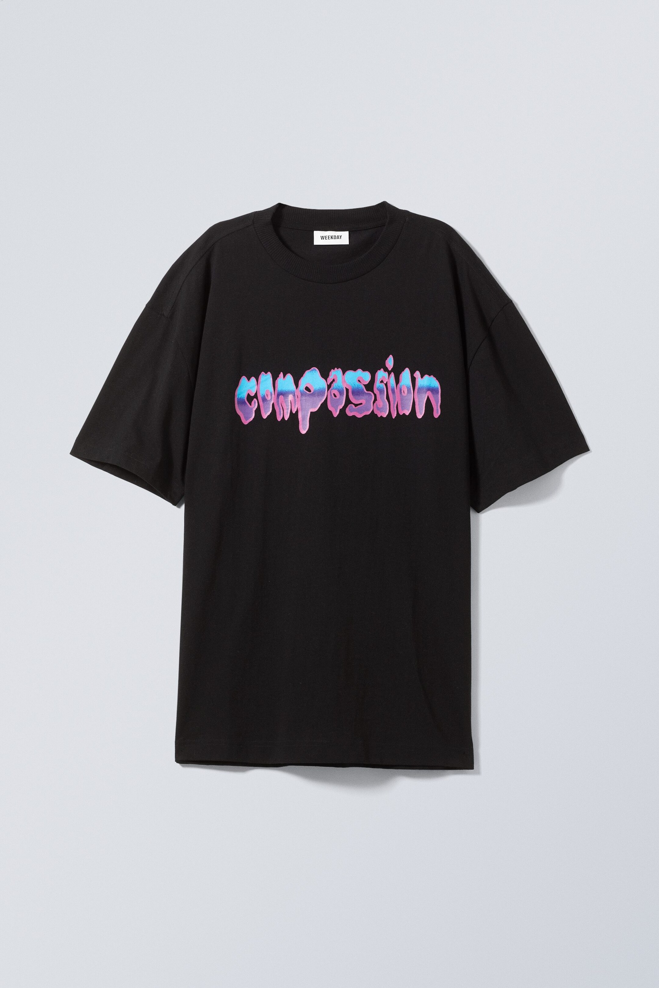 Text Compassion - Oversized T-shirt med grafiskt tryck - 0