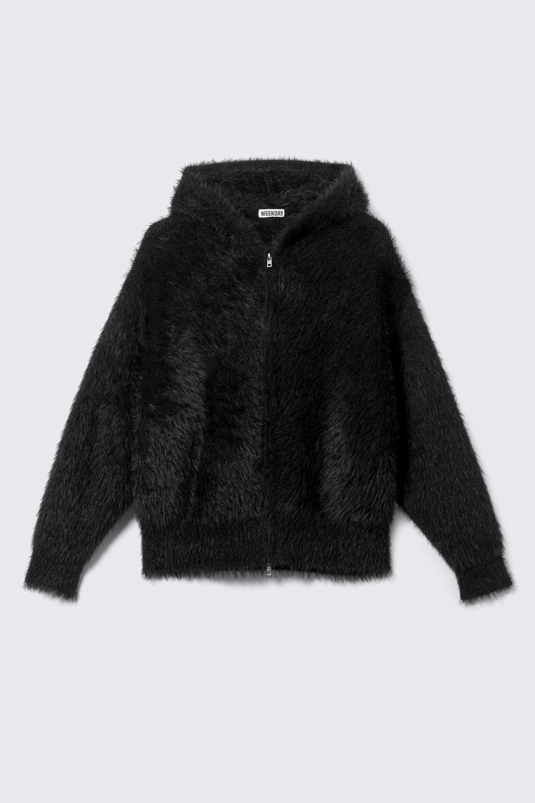 View larger image: The FRONT showcases a black shaggy hoodie, complete with a full-zip fastening, an attached hood, and a visible "WEEKDAY" brand label inside the neck.