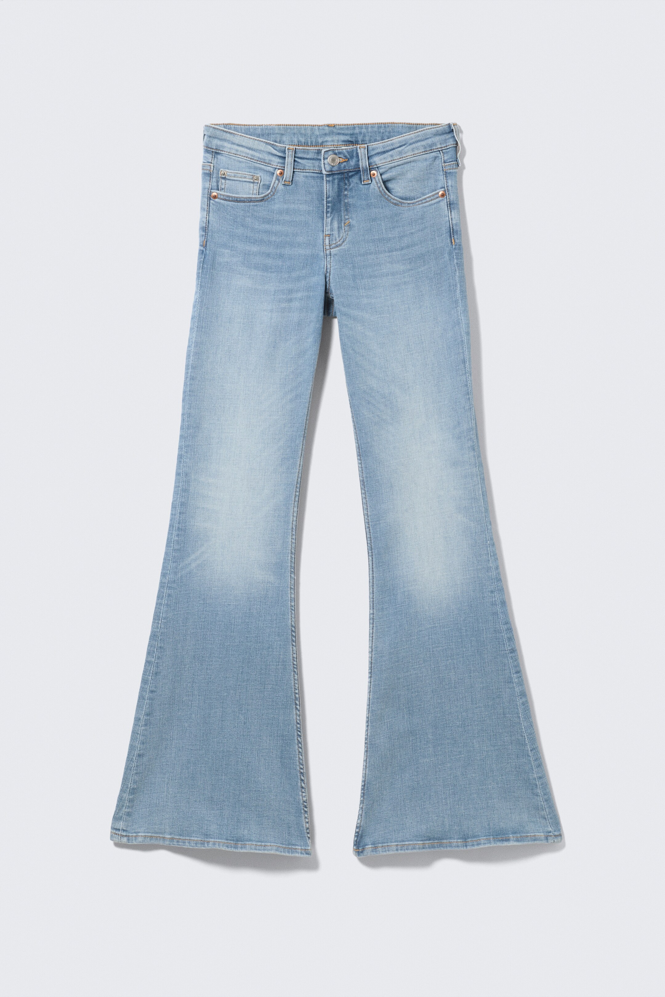 View larger image: A pair of light blue wash flared jeans is being displayed in a front view, laid flat. The jeans are featuring a five-pocket style with copper-toned rivets, belt loops, and a button and zipper fly, while showing subtle whiskering at the thighs and a wide flare from the knee downwards.