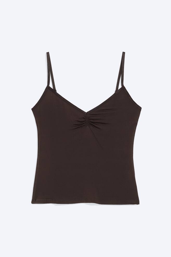 The image displays a dark brown camisole from the front, showcasing a V-neckline with central ruching and slender spaghetti straps. - 1