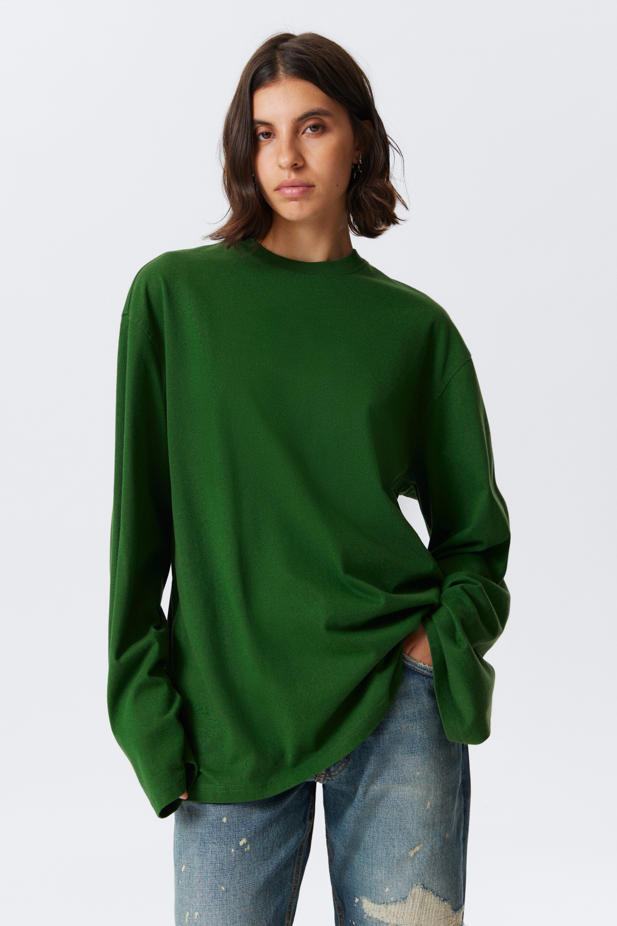Visa större bild: En oversized långärmad t-shirt - Mörkgrön - DAM | H&M SE 1