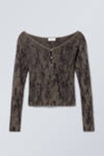 Schwarz gemustert - Eng anliegende Strickjacke aus Jacquard - 0