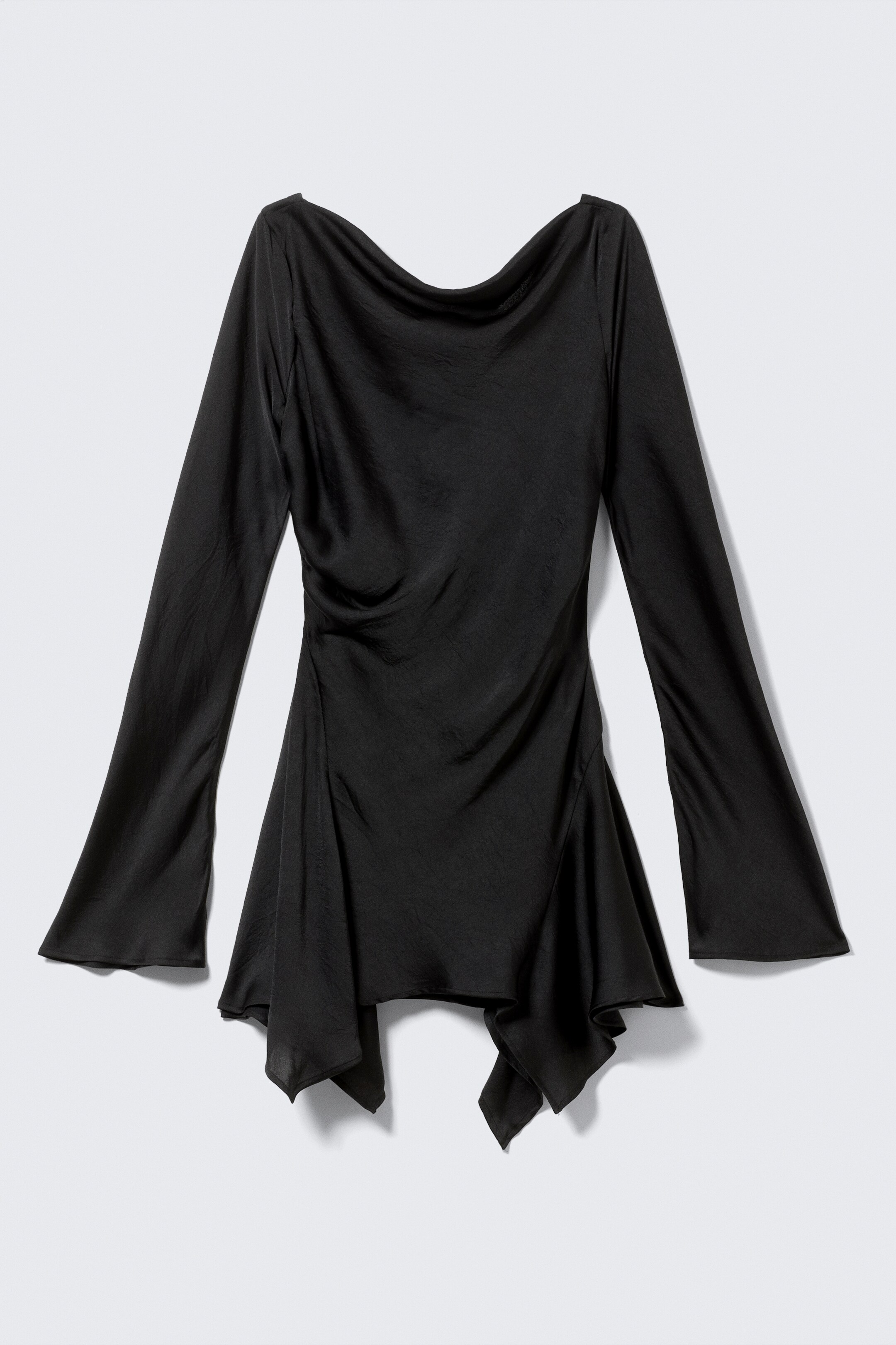 View larger image: A black top is featuring a draped cowl neck and long, flared bell sleeves, presented from the front. The top is showcasing an asymmetrical hemline with pointed drapes.