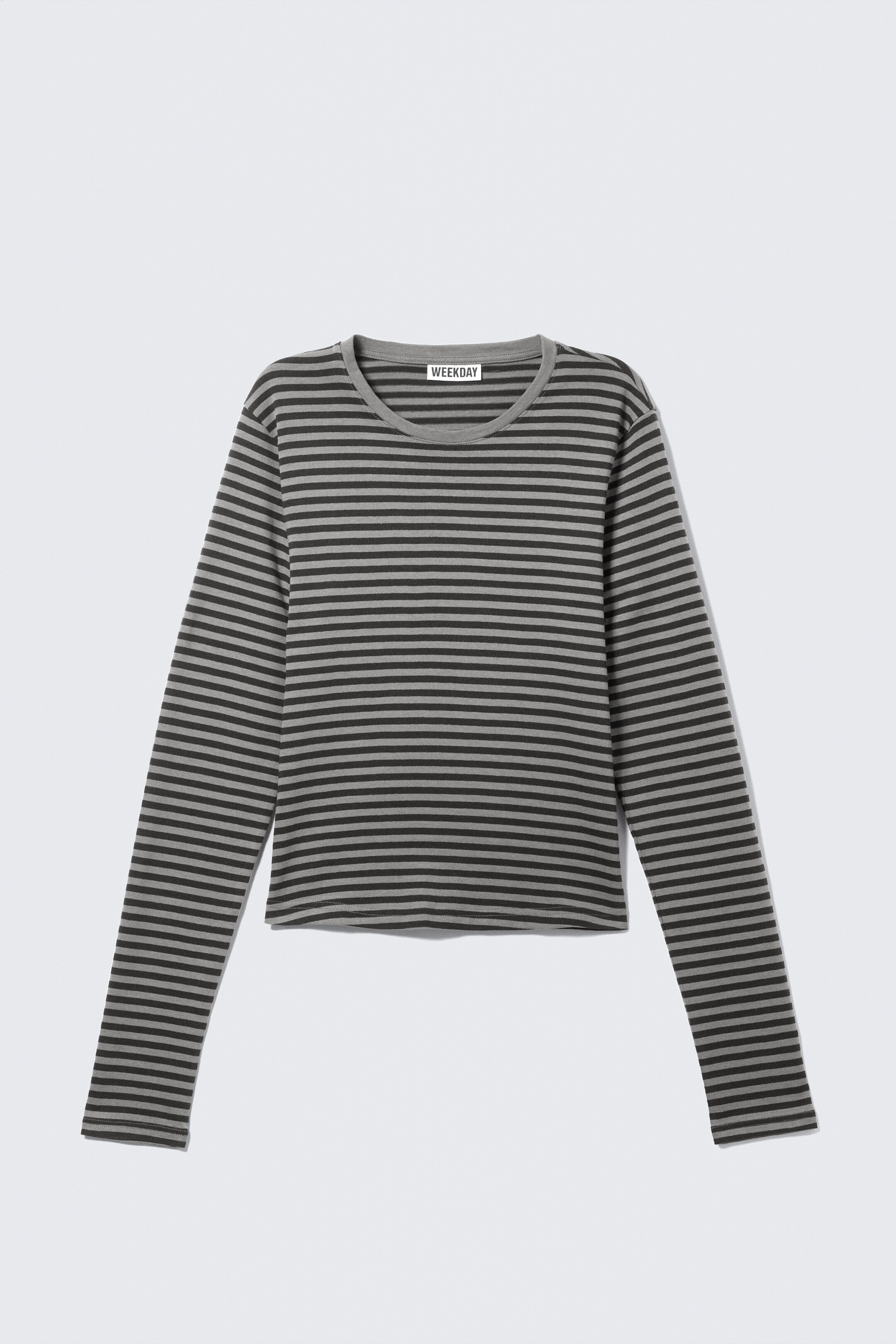View larger image: A long-sleeved top is presenting its front, featuring grey and dark grey horizontal stripes, a round neck, long sleeves, and a "WEEKDAY" label visible at the back of the neck.
