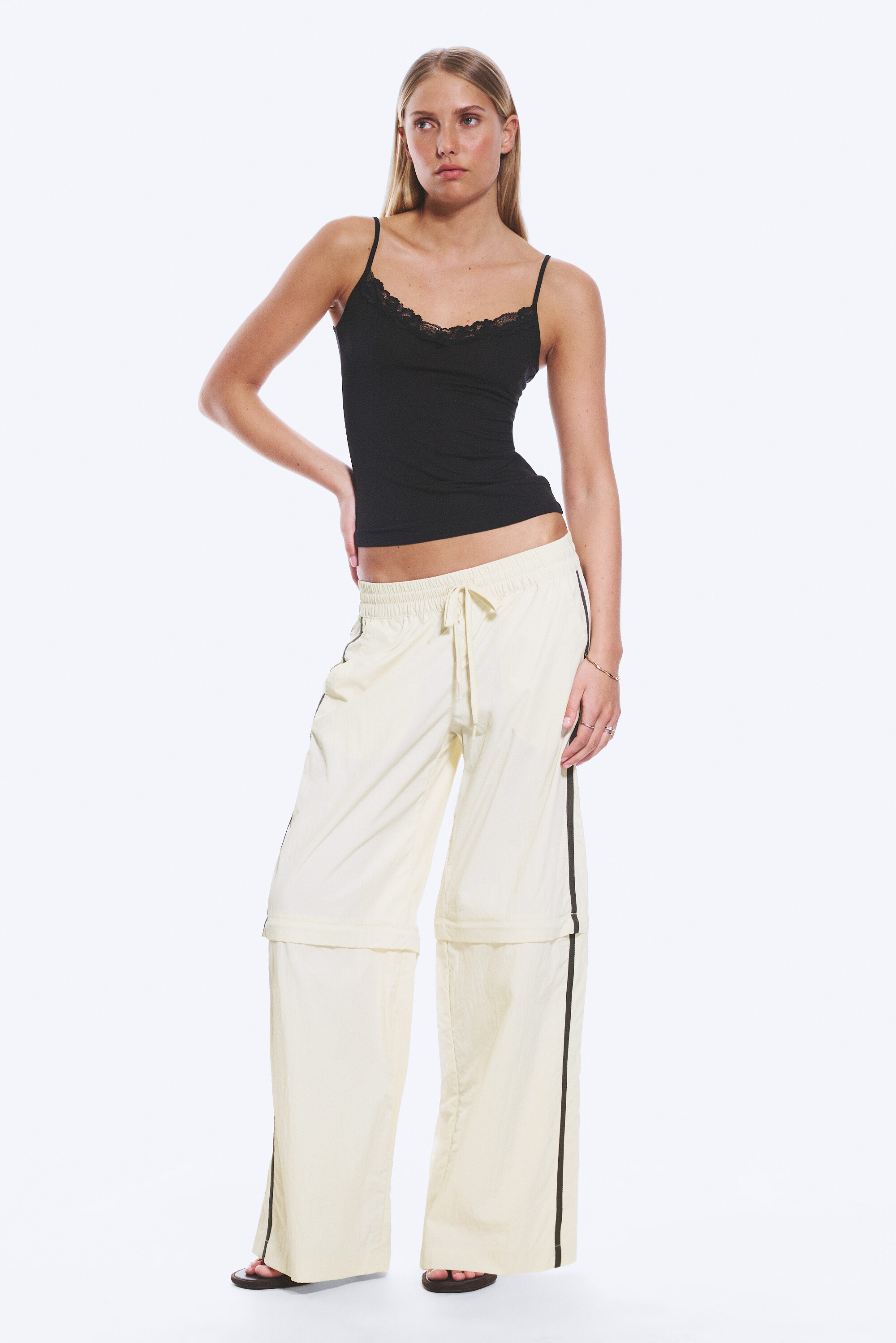 zip-off nylon track trousers - Beige - Black Stripe | Monki GB