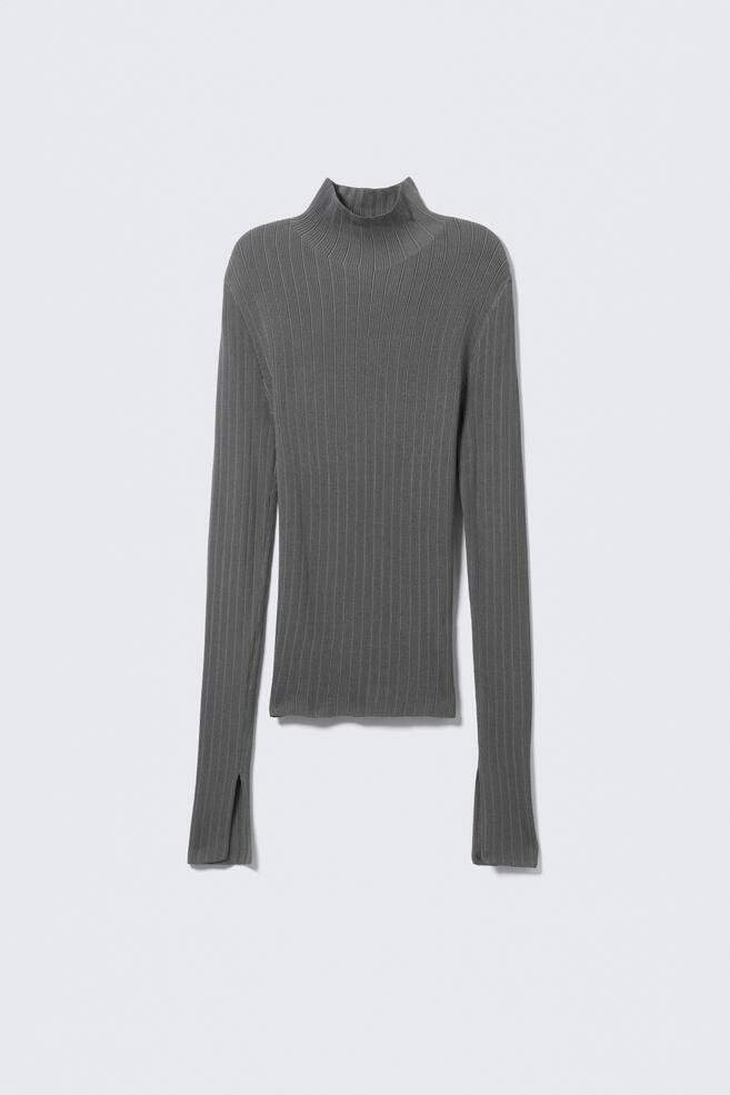 A gray, slim-fit top is being presented FRONT, featuring a fine rib-knit texture. It is designed with a high, single-layer mock neck and long, fitted sleeves that are ending in slits at the cuffs, and a straight hem. - 1
