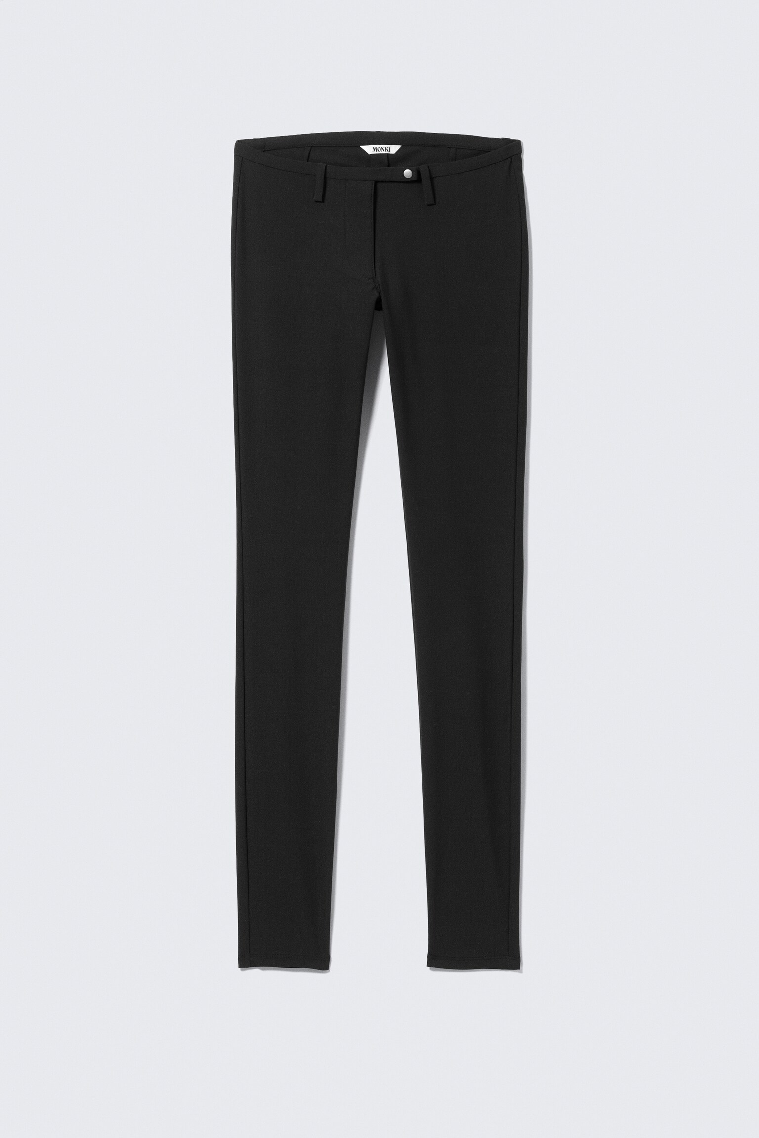 Matala vyötäröinen kapealahkeiset puvuntregginsit - Musta