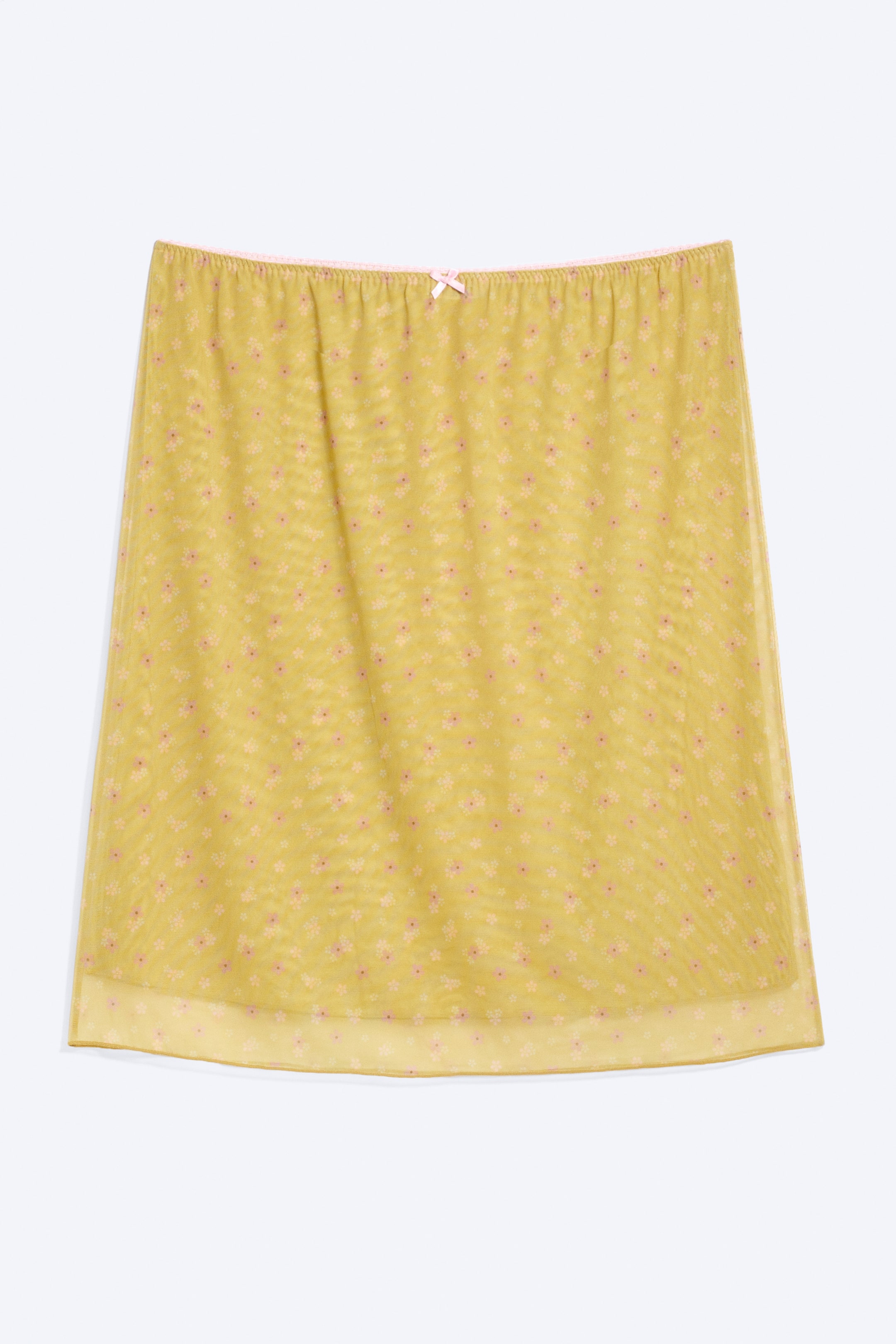 Grotere afbeelding bekijken: Een geel-groene, knielange, slim-fit rok toont zijn voorkant. Hij is gemaakt van dubbelgelaagd mesh met een roze bloemenpatroon en heeft een elastische tailleband met een roze bies en een kleine roze strik aan de voorkant.