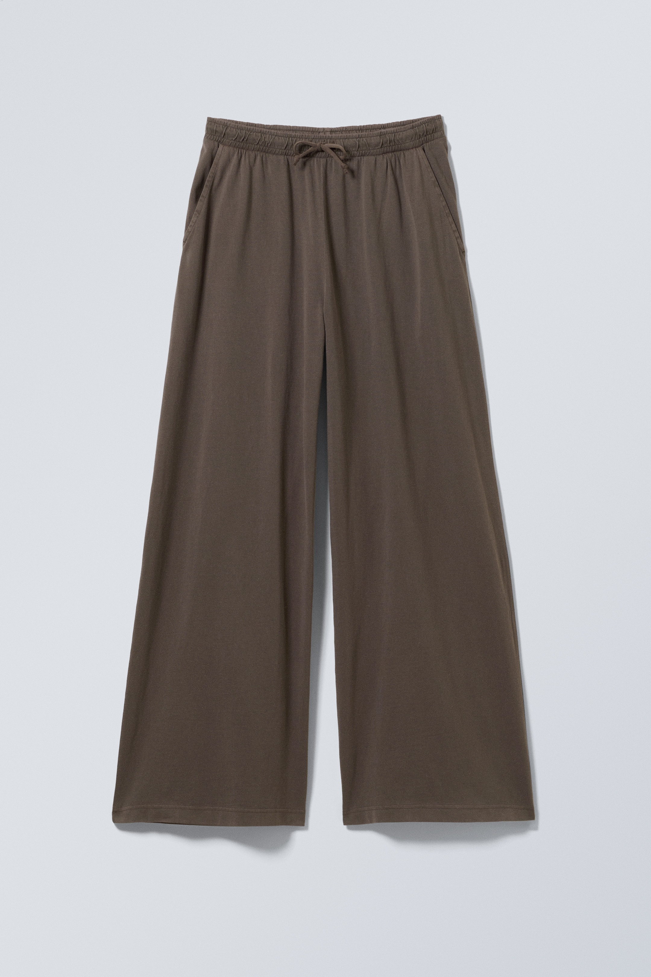 Ver imagem maior: Calças em jersey de perna larga e corte solto - Castanho escuro com lavagem - SENHORA | H&M PT 1