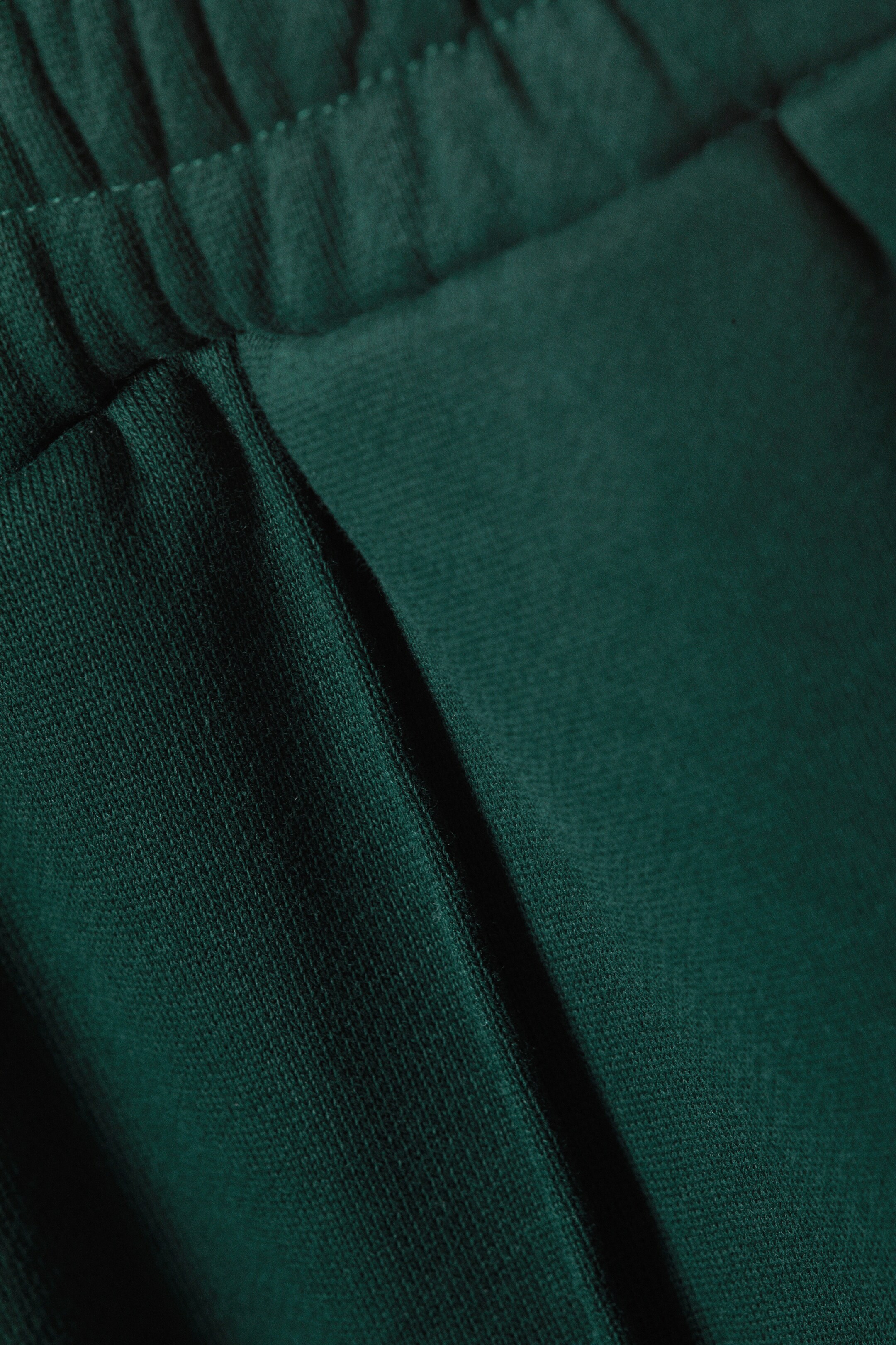 Größeres Bild ansehen: Ausgestellte, locker sitzende Sweatpants - Dunkelgrün - Men | H&M DE 2