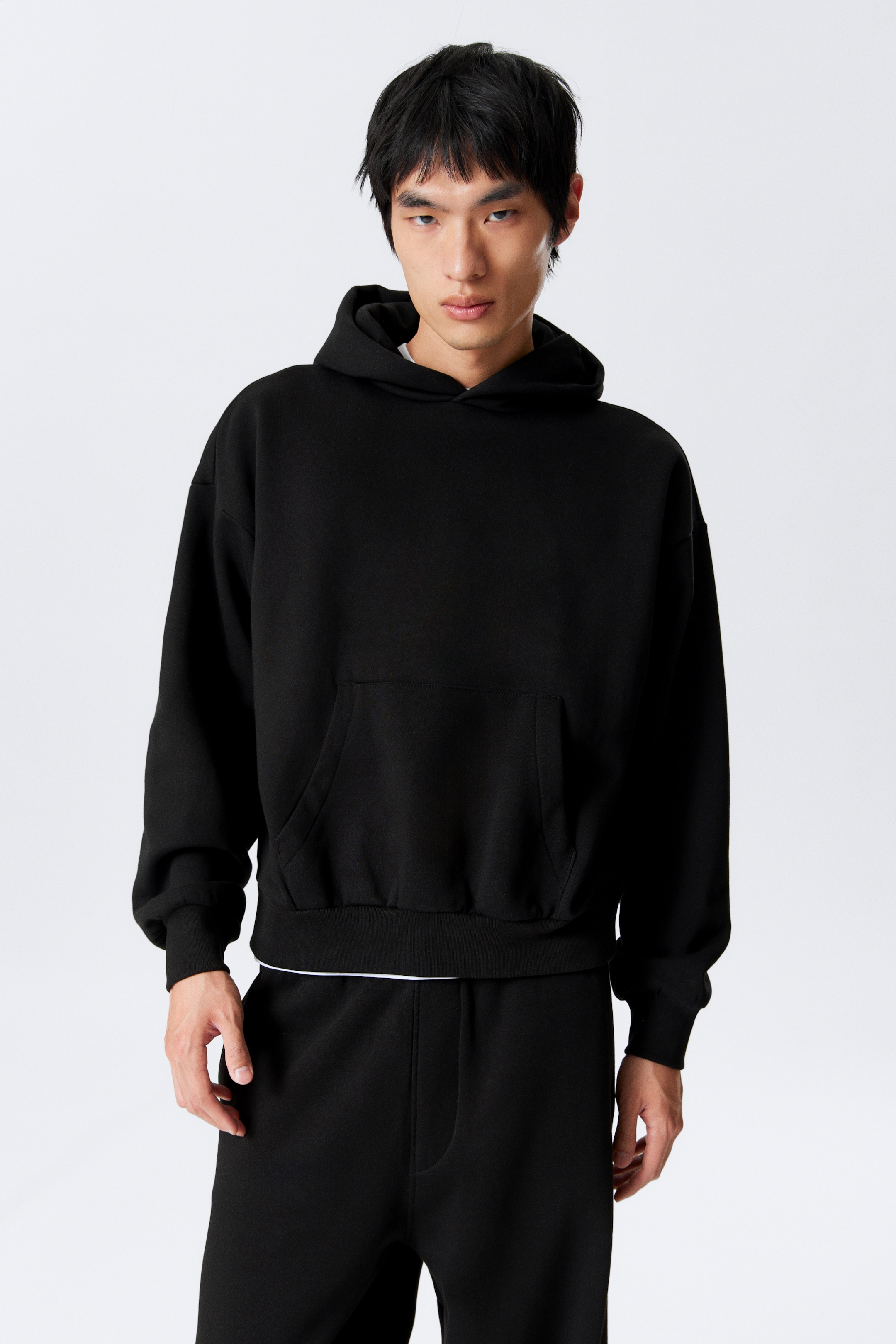 Größeres Bild ansehen: Hoodie mit weiter Passform - Schwarz - Men | H&M DE 1