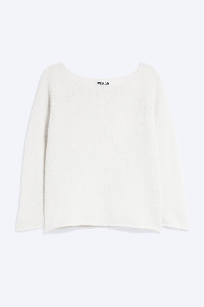 A white fine-knit sweater is shown from the front, featuring a wide boat neckline, three-quarter-length sleeves, and rolled edges at the cuffs and hem. - 1