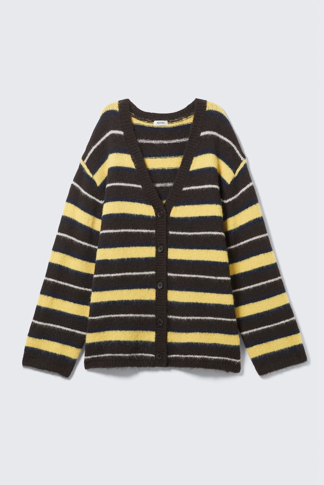 A front-facing, fuzzy cardigan is lying flat, featuring a dark brown base with horizontal yellow, and thinner white and dark blue stripes. It has a V-neckline and a front button closure with six dark buttons. - 1