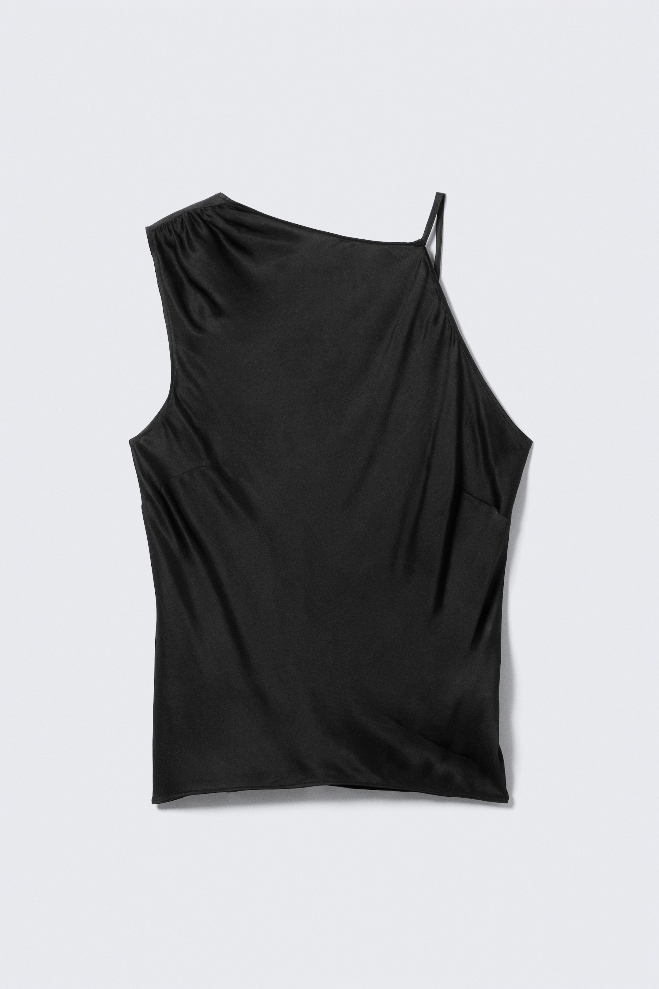 View larger image: A black sleeveless top is presenting FRONT, featuring an asymmetrical design. Gathering details are visible on the left shoulder, a thin strap is extending from the right shoulder, and darts are shaping the front of the top.