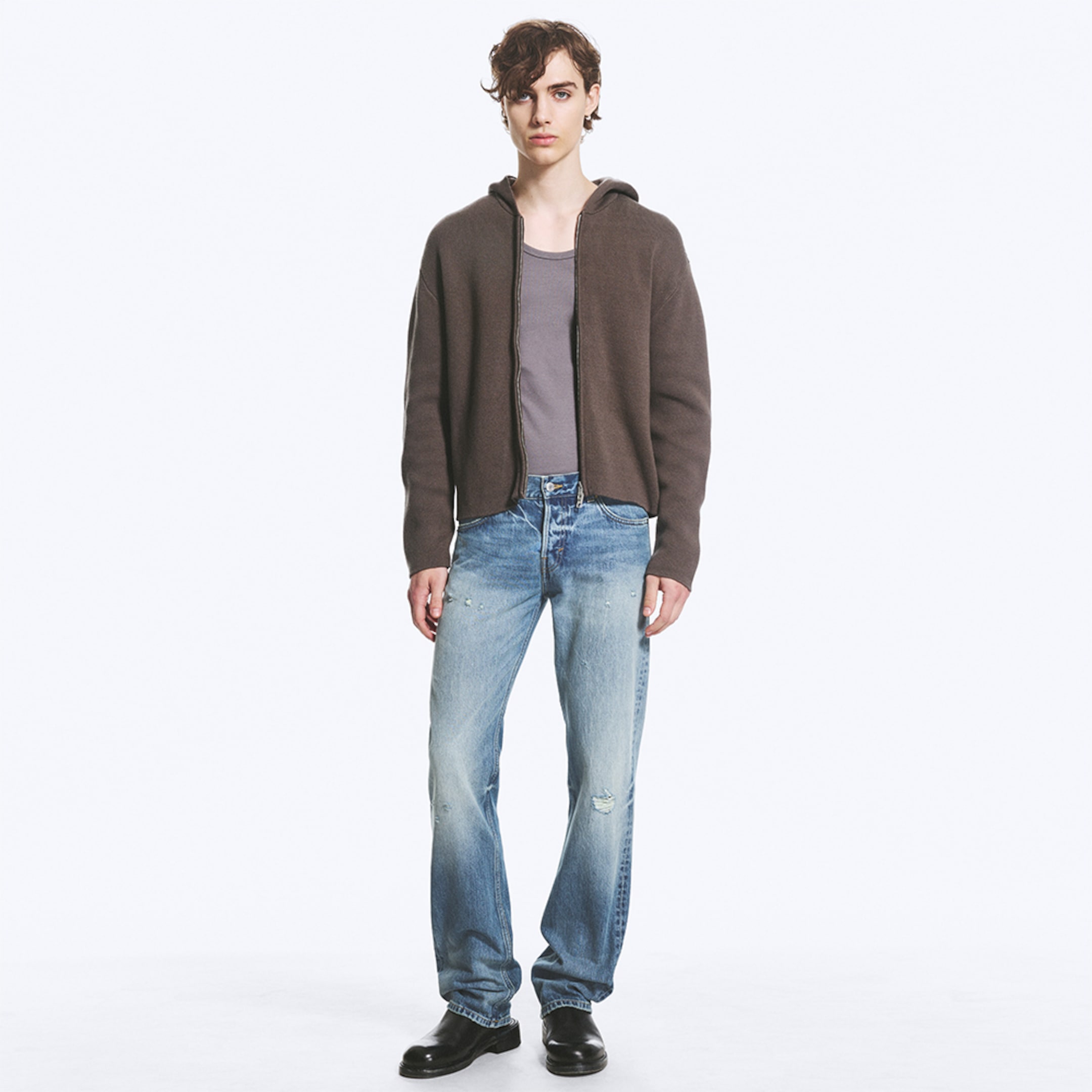 Model wearing a pair of regular fit jeans