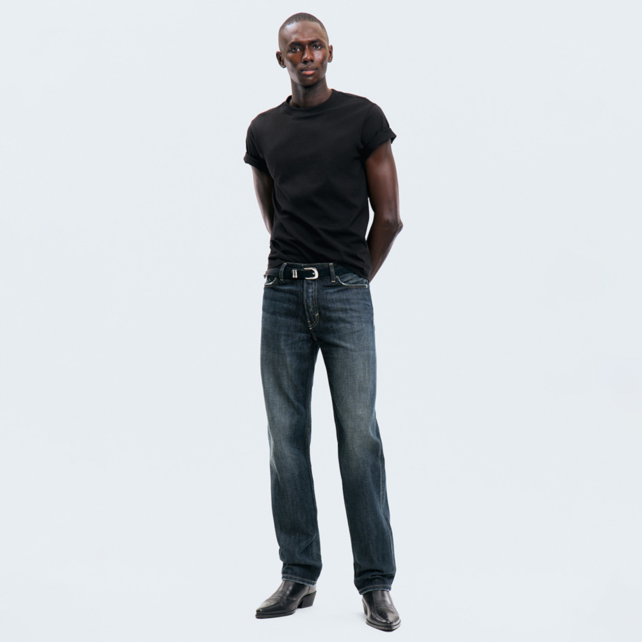 Model wearing a pair of regular fit jeans