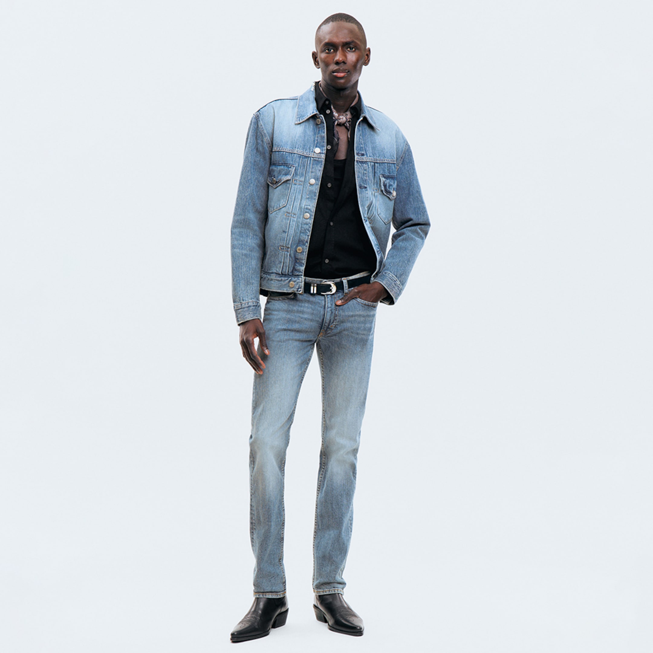 Model wearing a pair of slim fit jeans