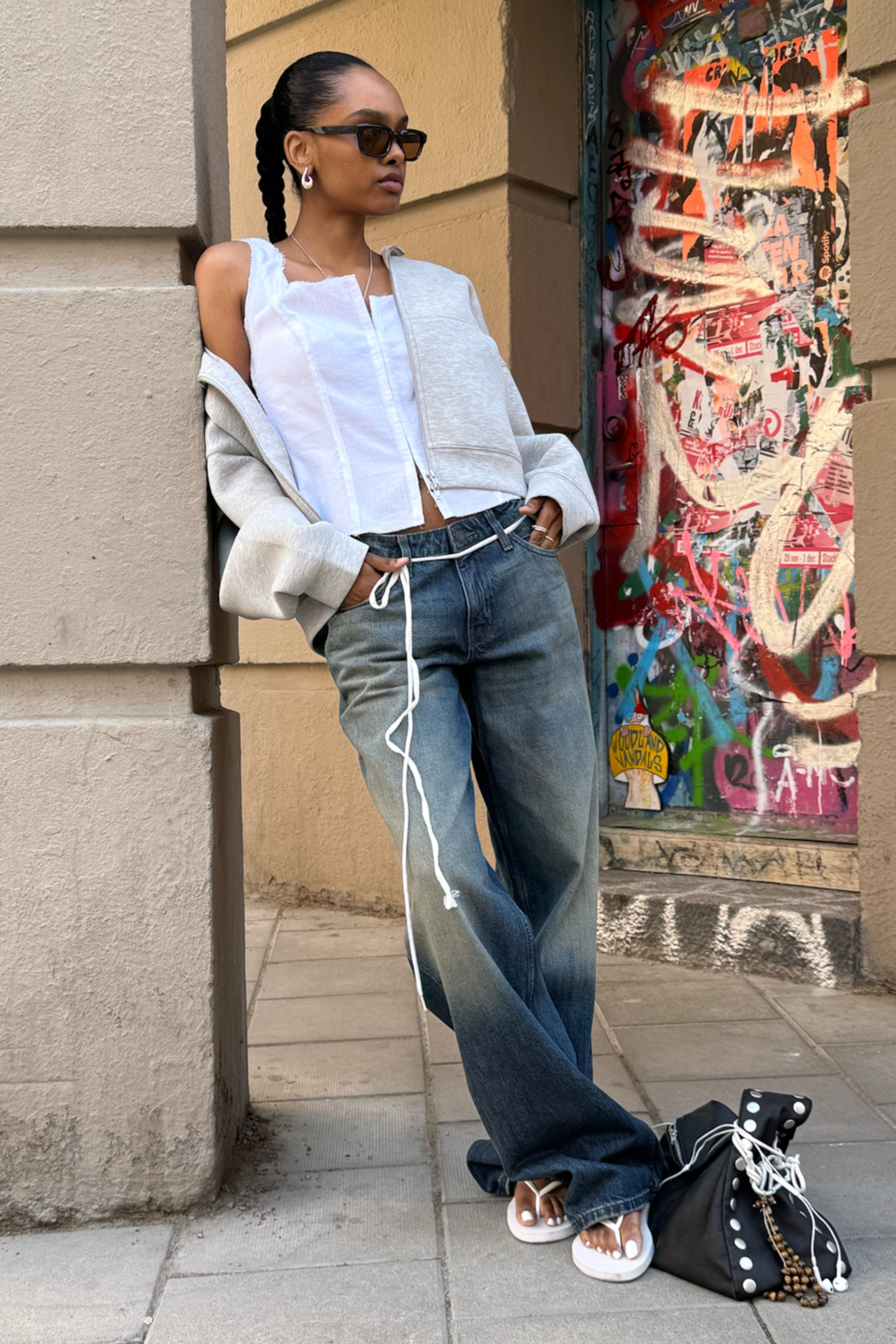 A girl wearing washed jeans from Weekday
