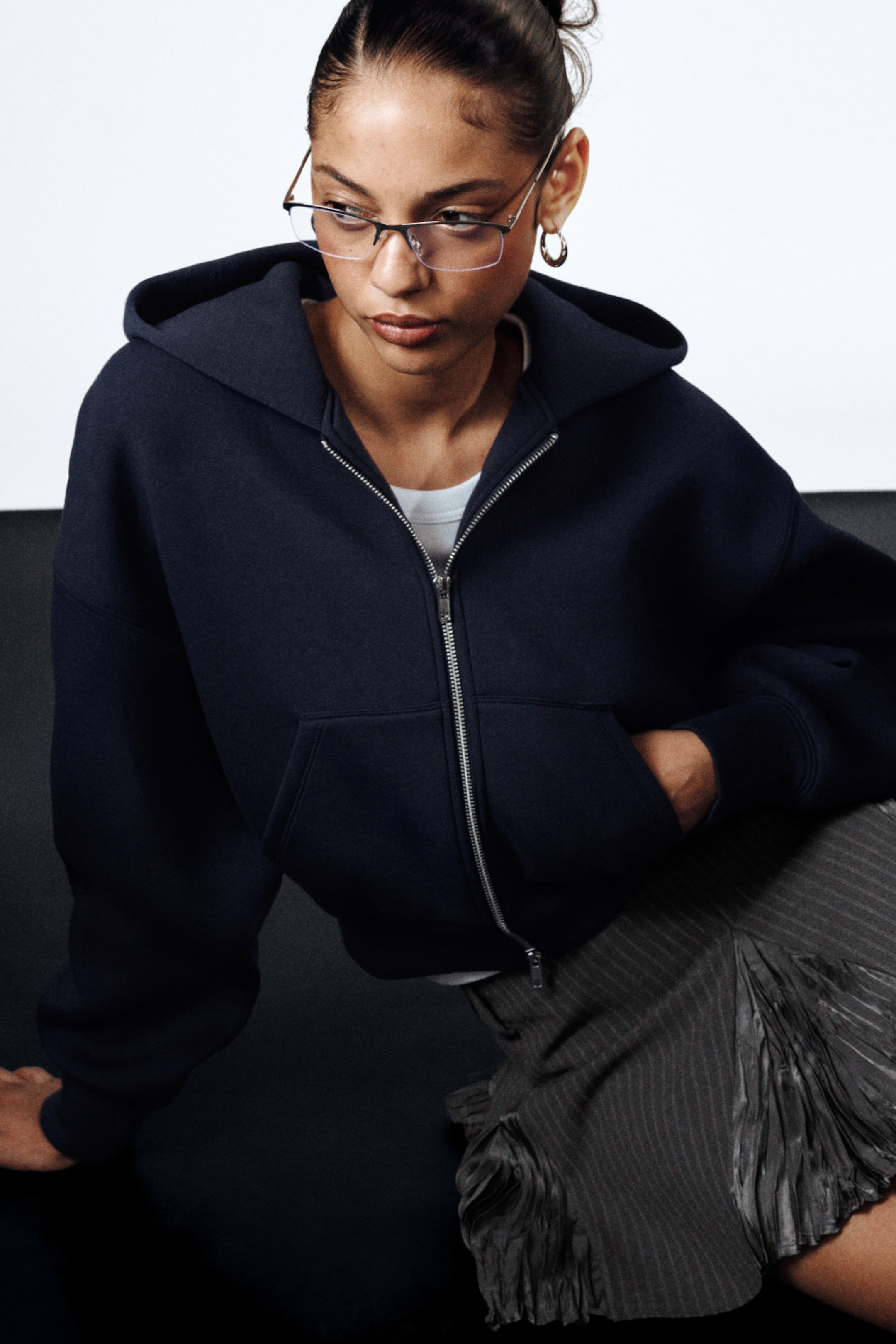 A woman wearing scuba zip hoodie from Weekday