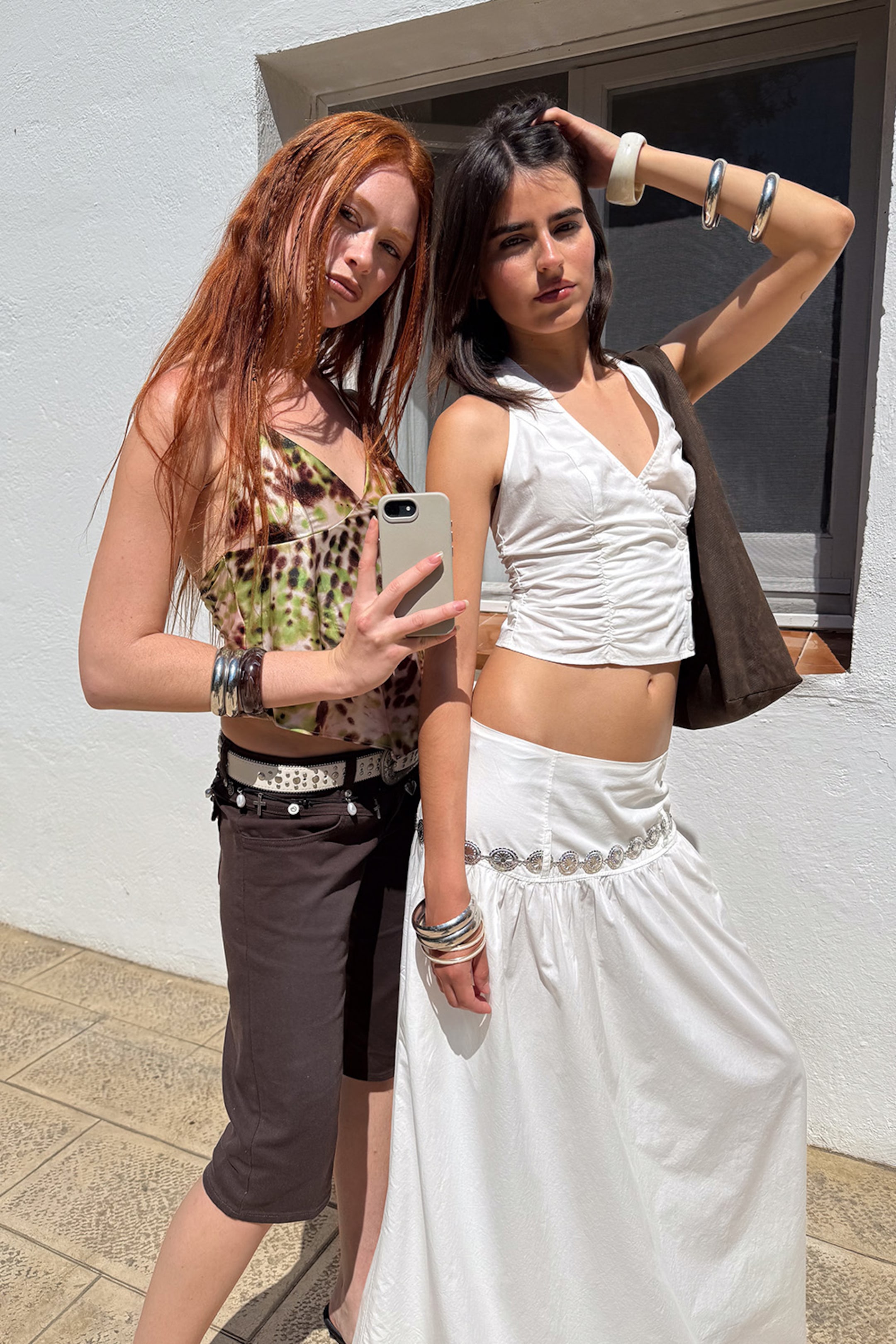 Two girls wearing boho-inspired outfits from Monki