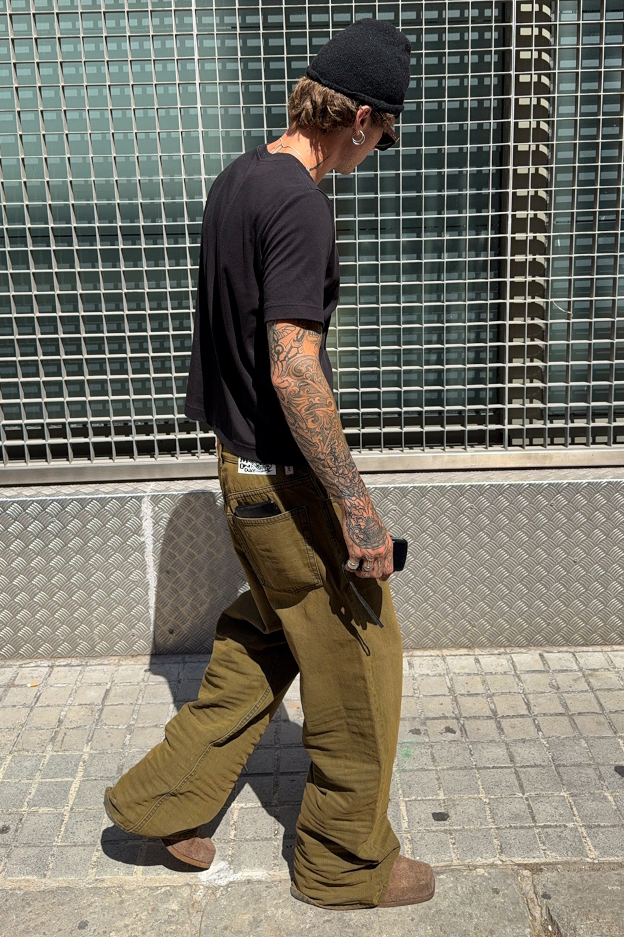 A model wearing clothing from the Weekday 2025 fall collection