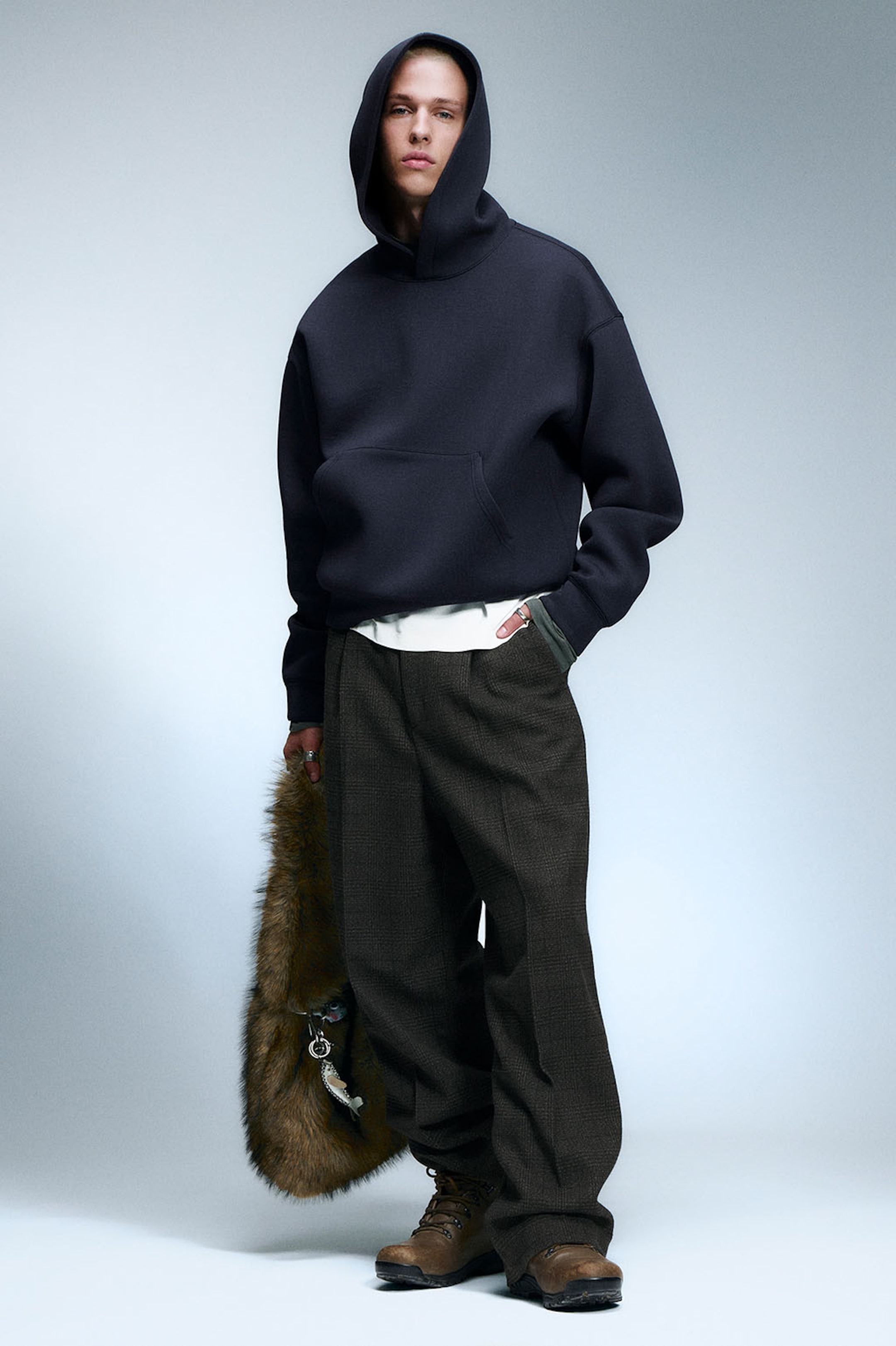 A model wearing clothing from the Weekday 2025 fall collection