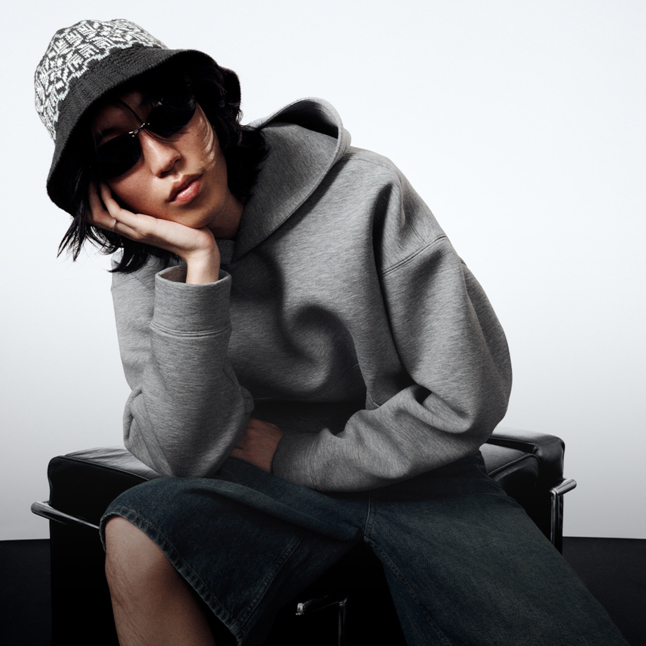 Model wearing a grey Simon Scuba hoodie and a pair of astro jorts