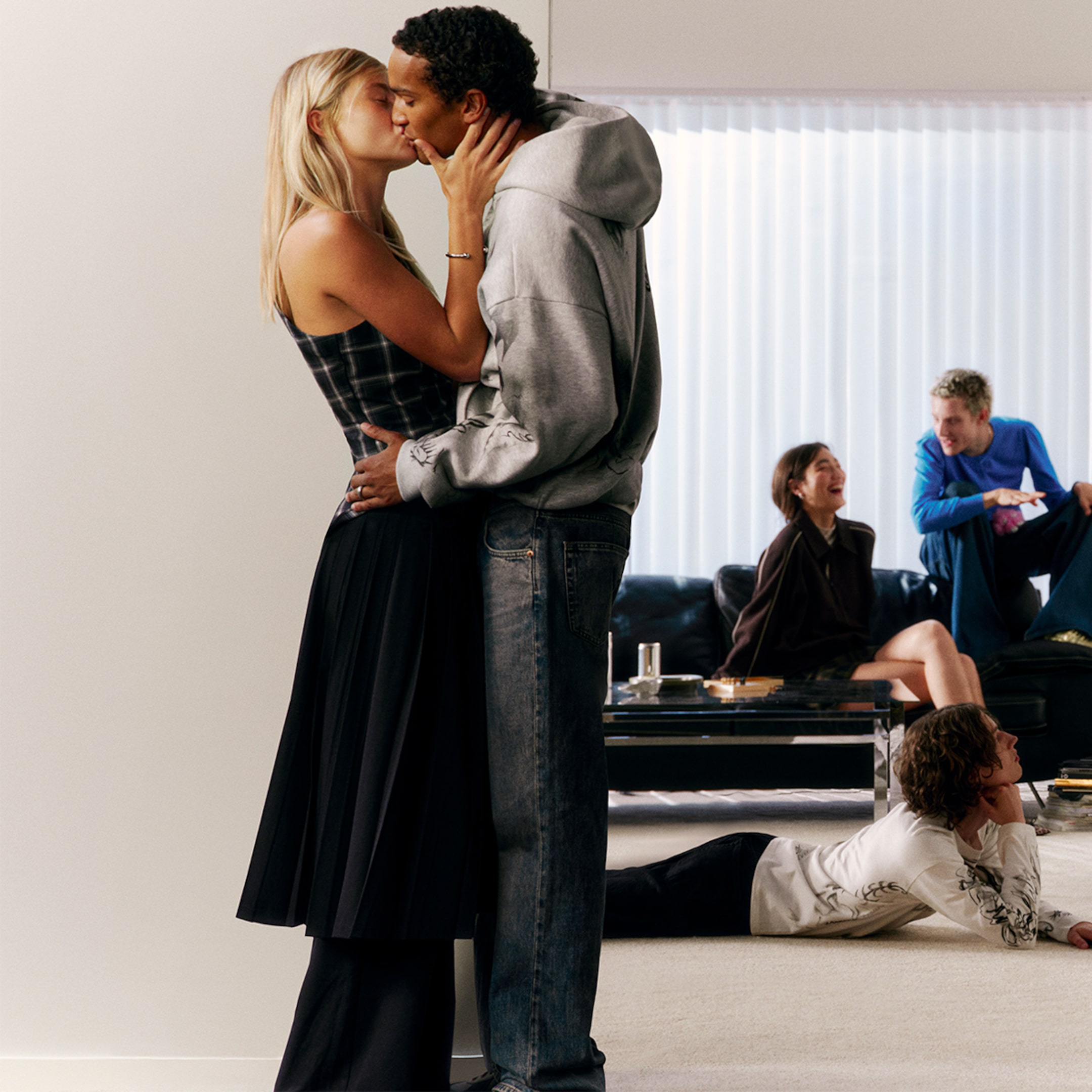 A woman and a man wearing outfits from Weekday collection