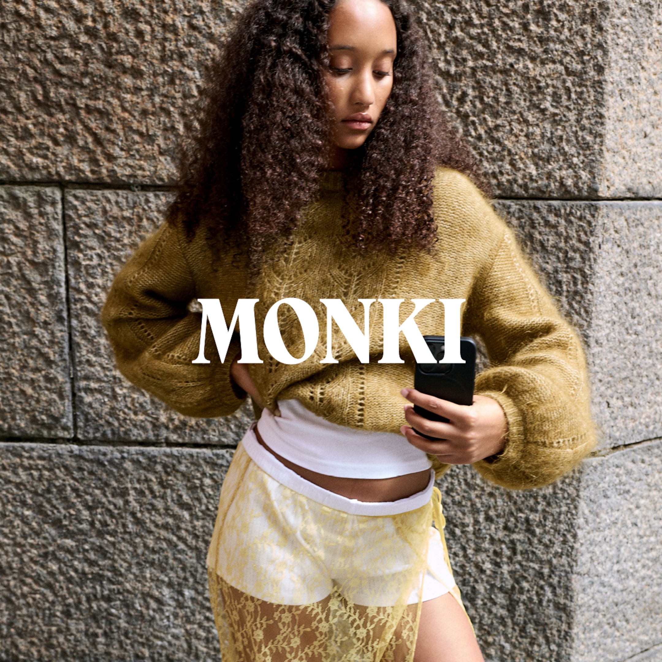 A woman wearing an outfit from Monki collection