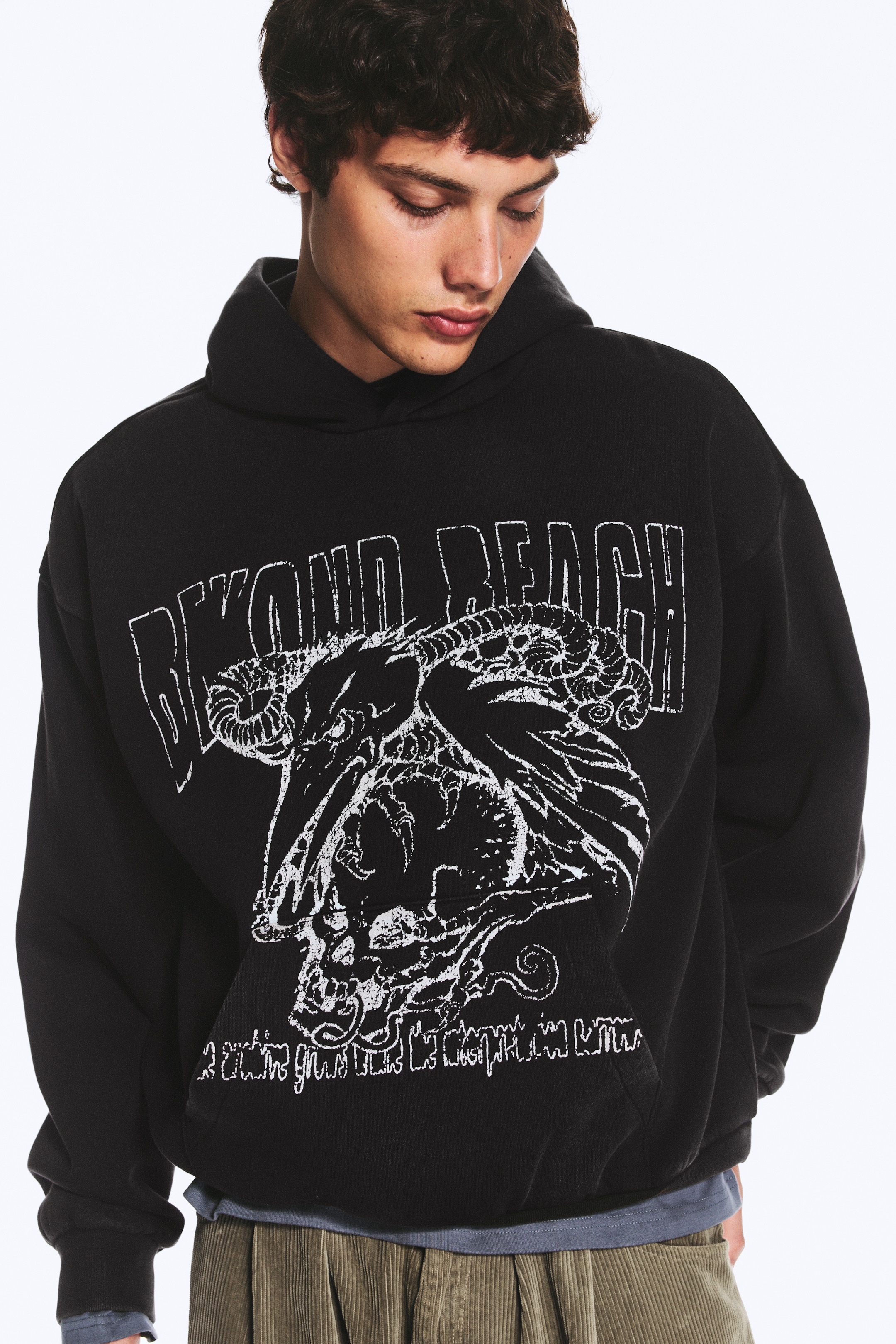 Noir - Au-delà de portée - Sweat à capuche graphique coupe ample