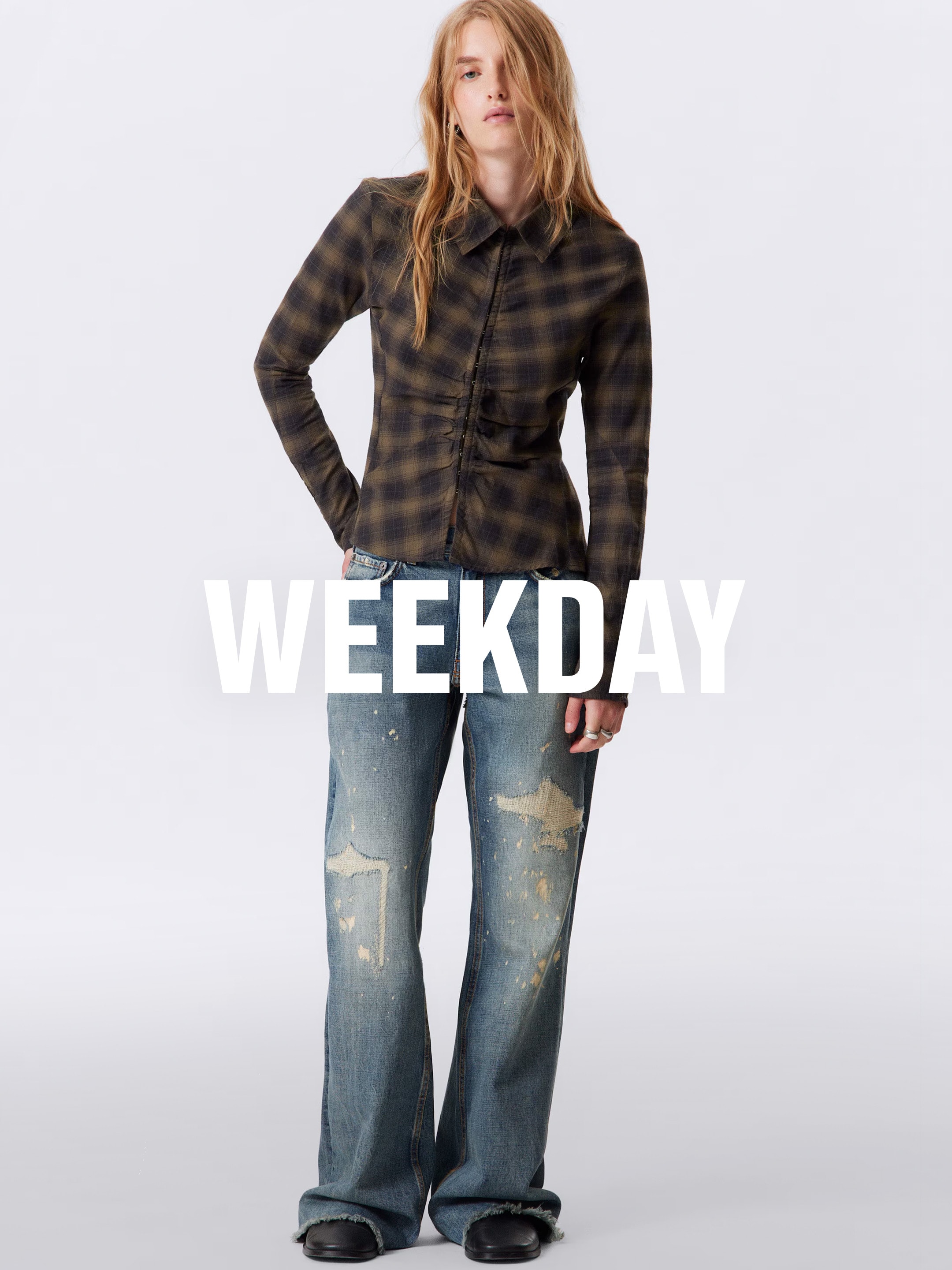 A woman wearing an outfit from Weekday collection