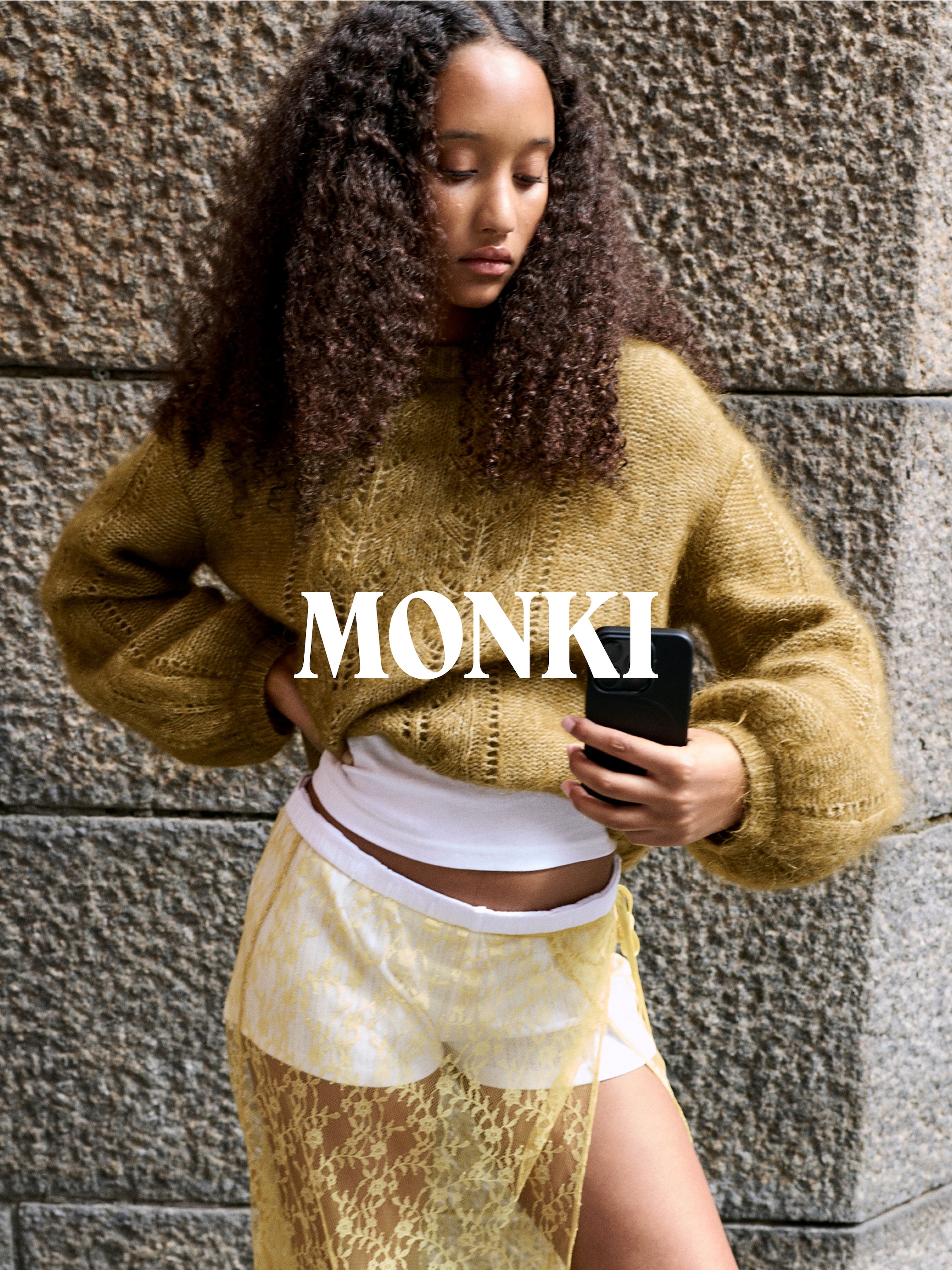 A woman wearing an outfit from Monki collection