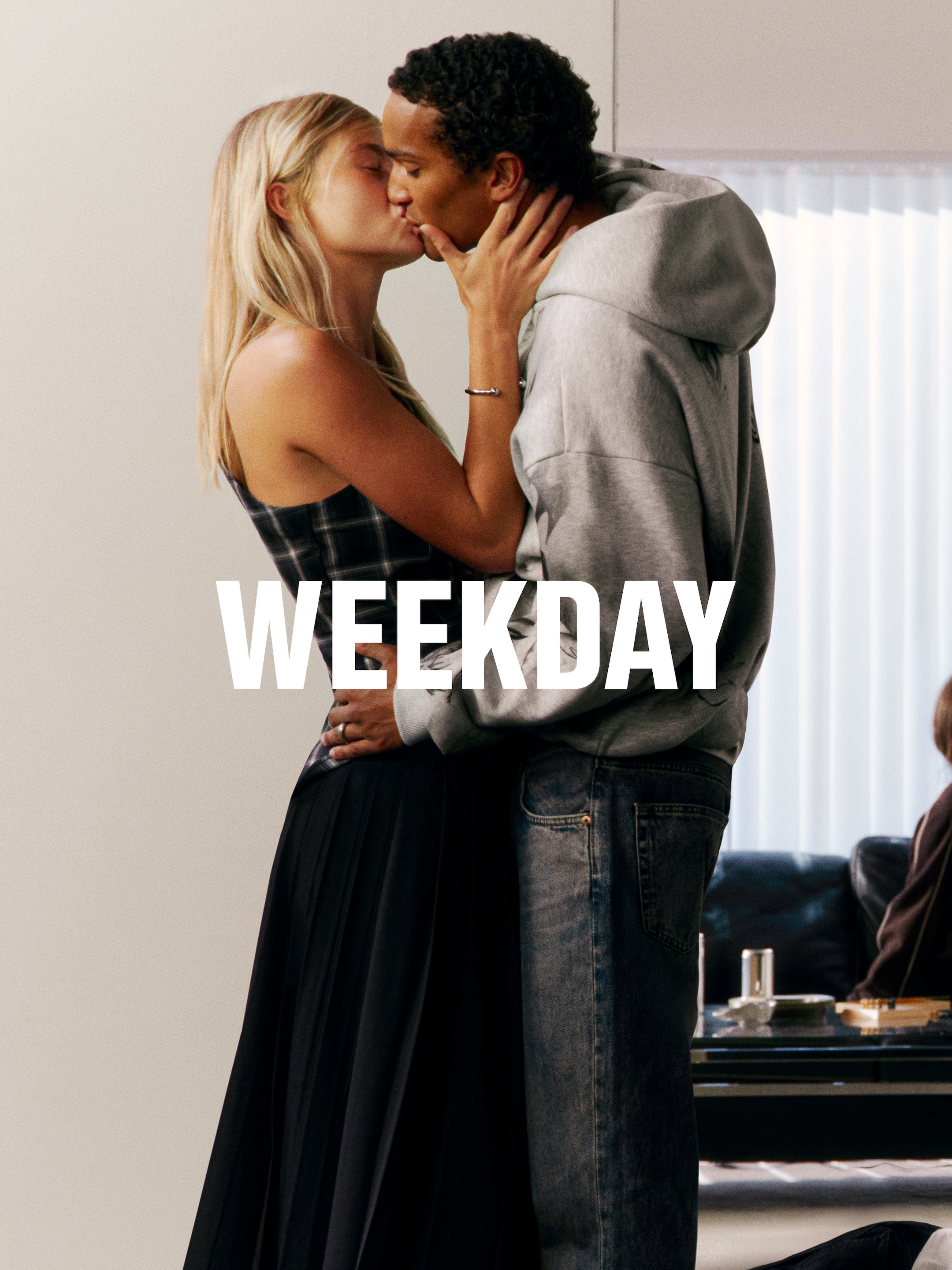 A woman and a man wearing outfits from Weekday collection